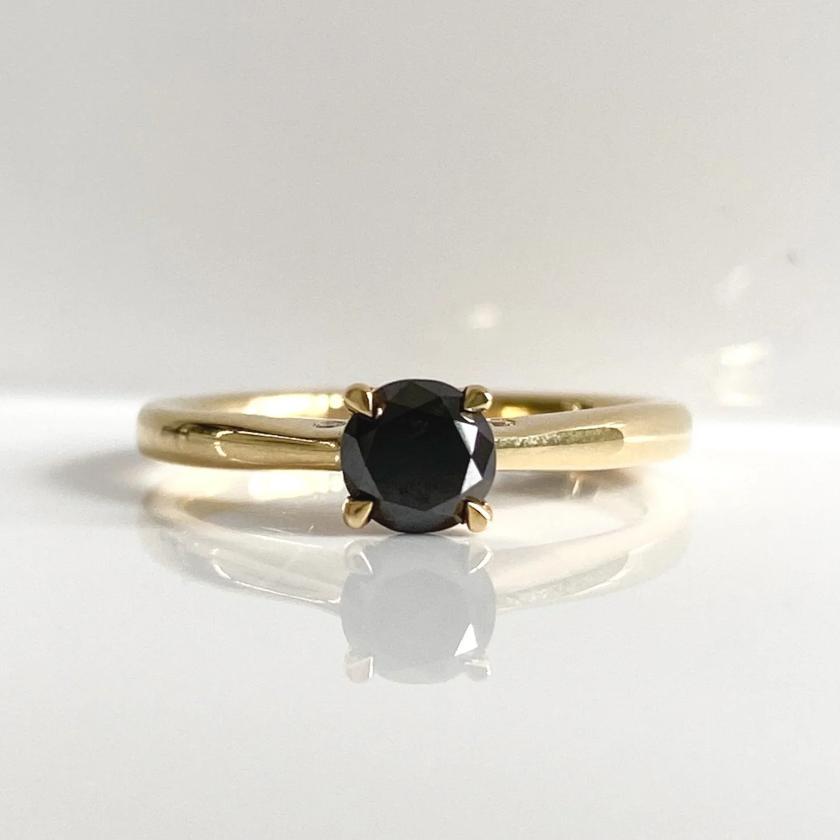 Yellow gold and black diamond solitaire