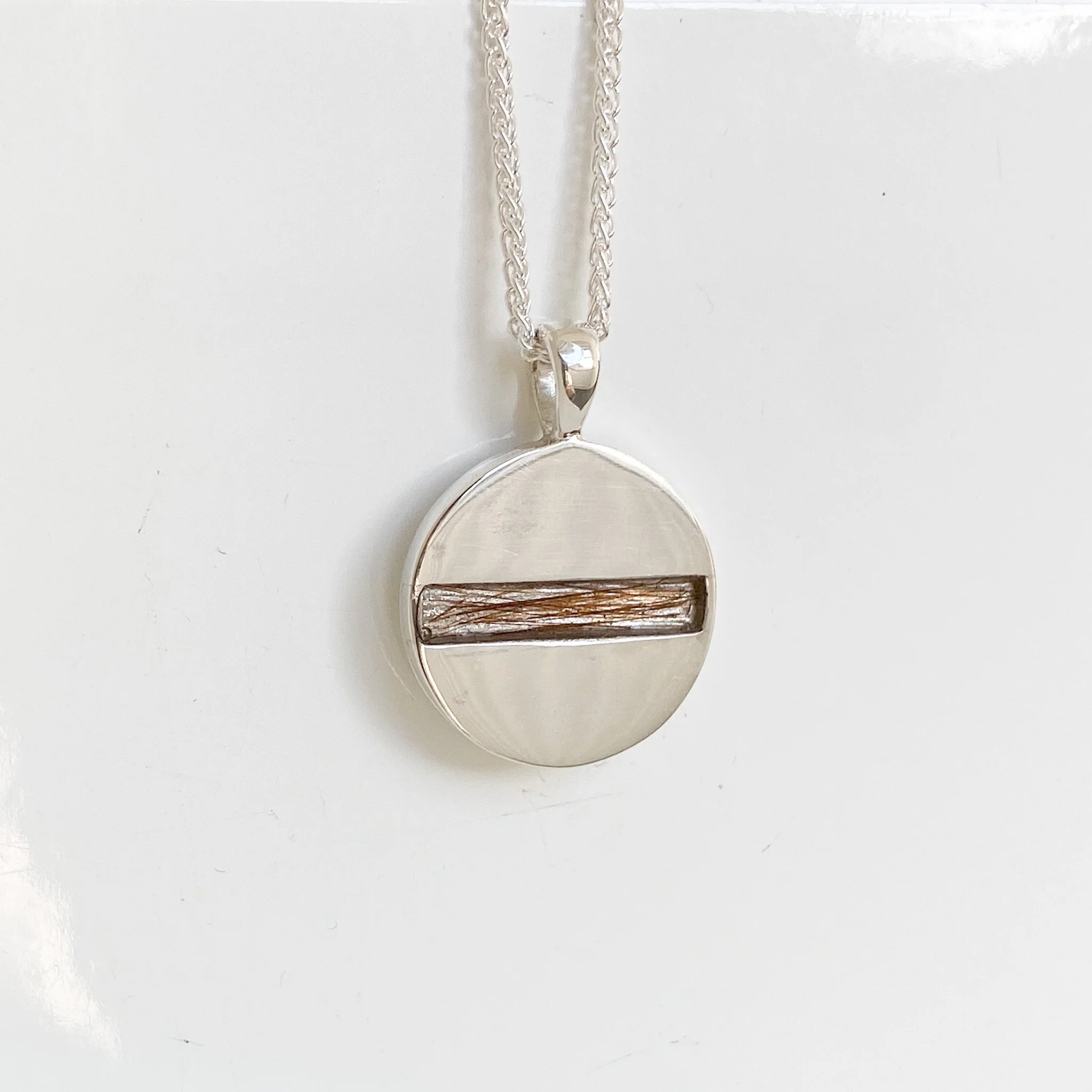 Hair in resin - Disc pendant