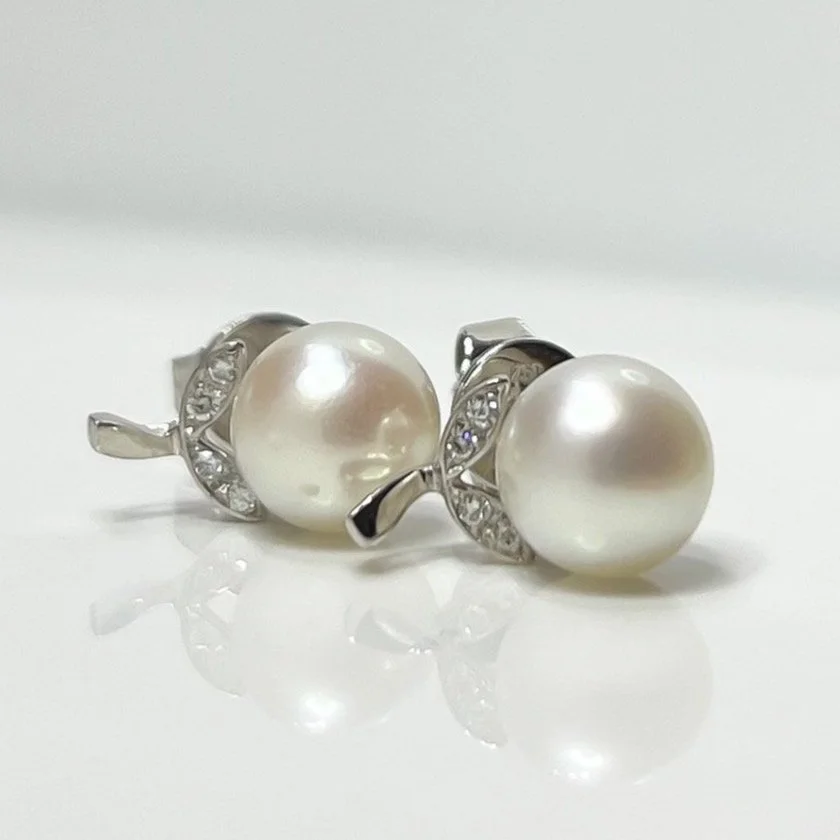 Pearl and diamond stud earrings