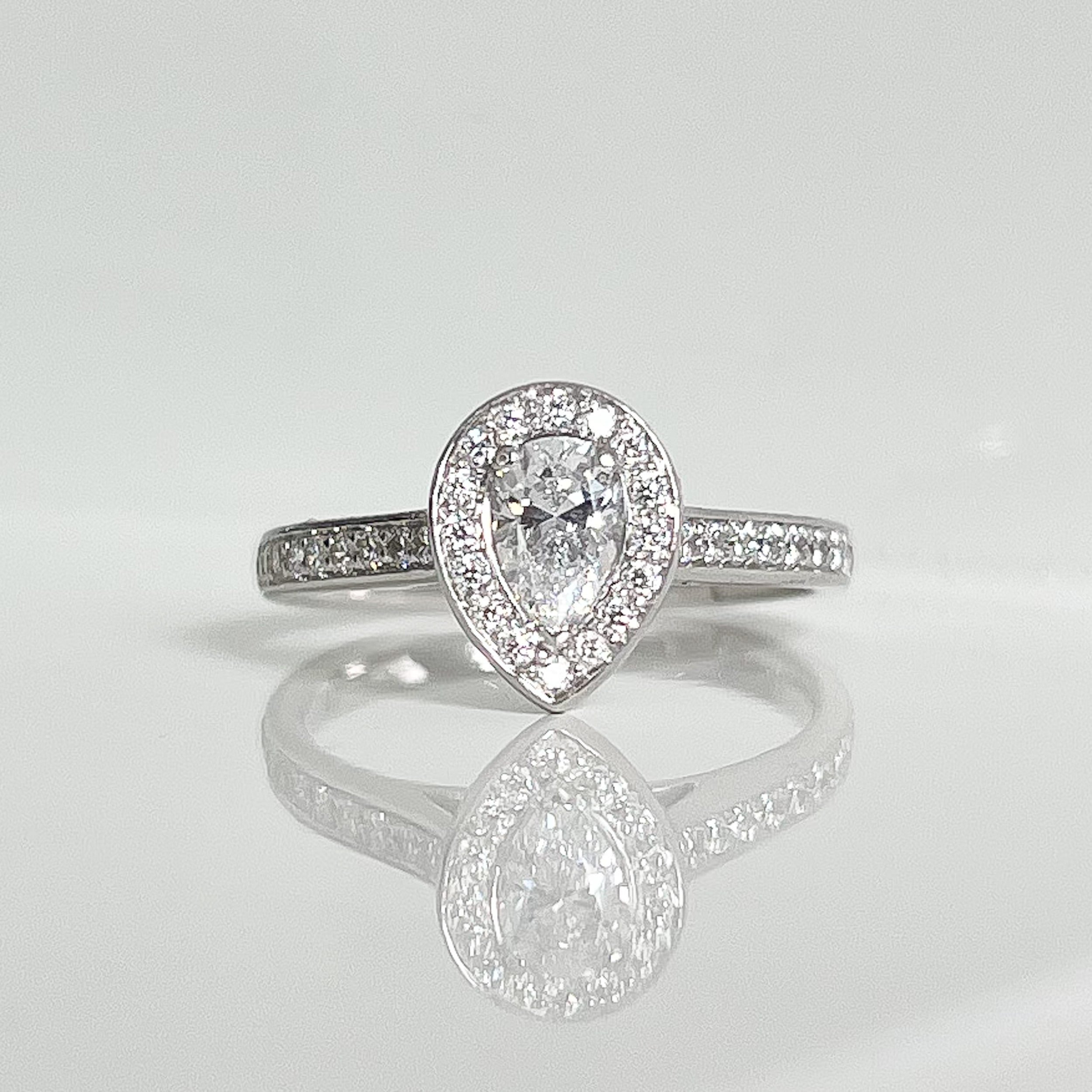 Pear-cute-diamond-halo-engagement-ring.jpeg