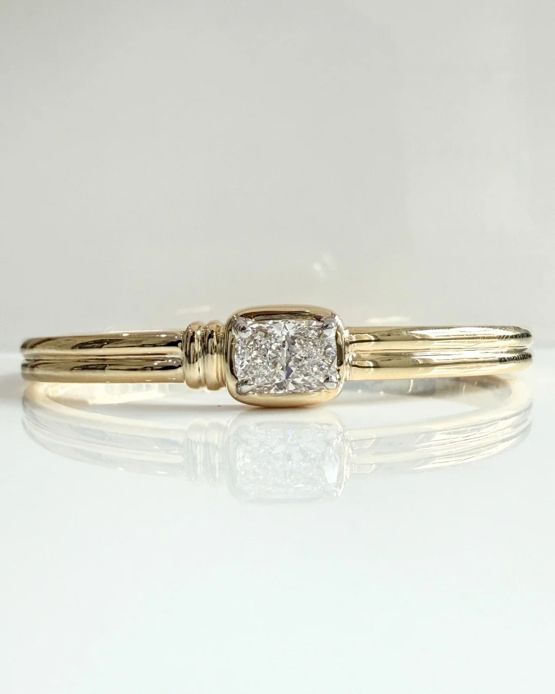 Becky had been looking to have a unique bangle designed as a birthday treat, she knew she wanted a bangle set with a diamond as the main feature. So she came in to see one of our designers, Abi to discuss how we could design the perfect piece for her