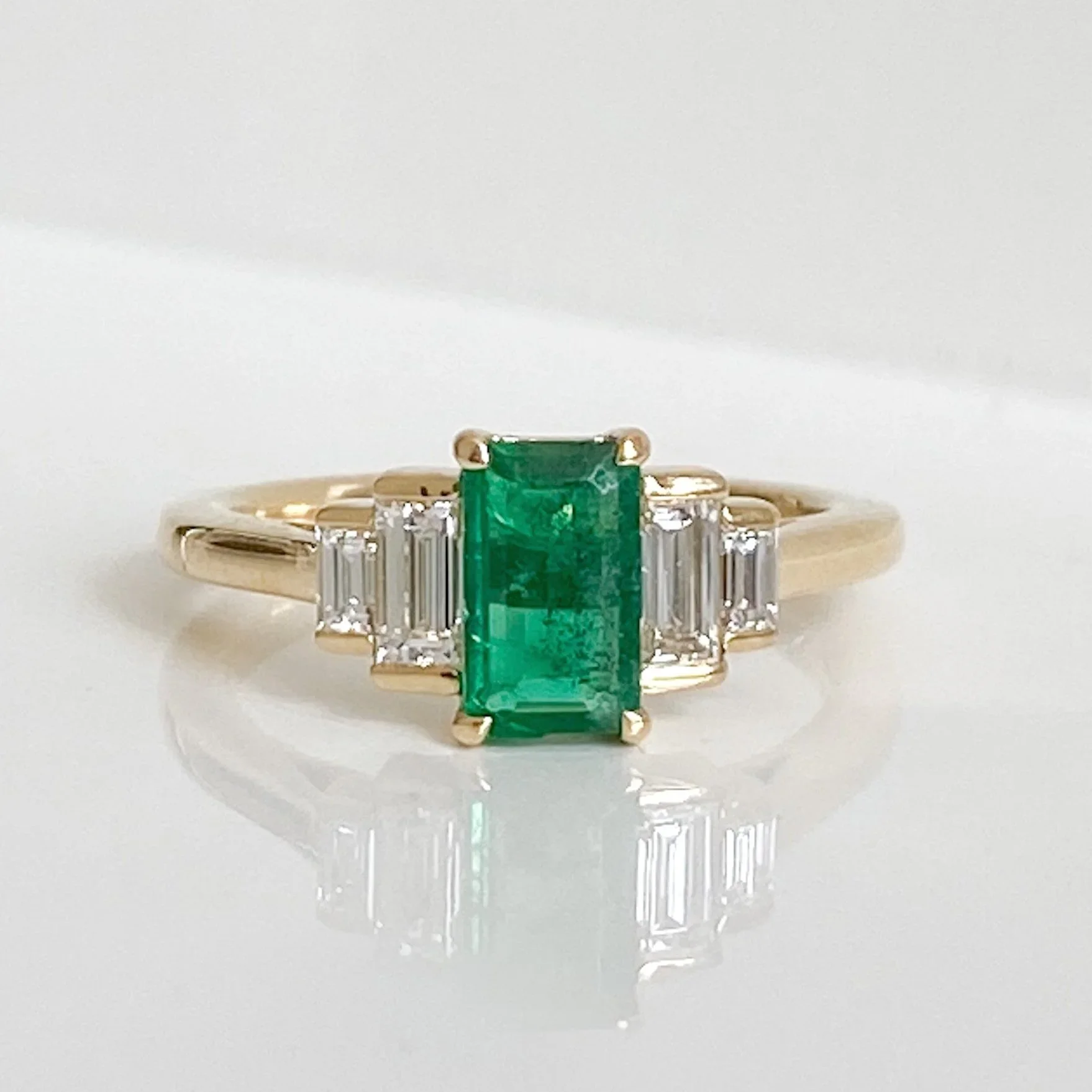 Yellow gold emerald and diamond art deco ring