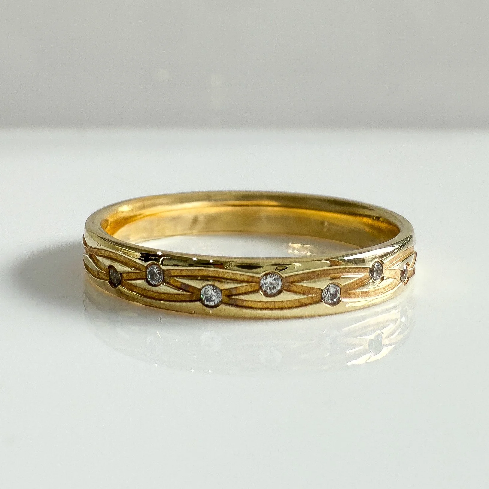Yellow gold engraved diamond set ring