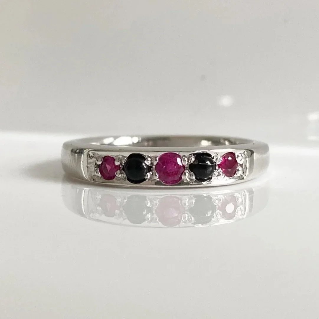White gold onyx and ruby engagement ring