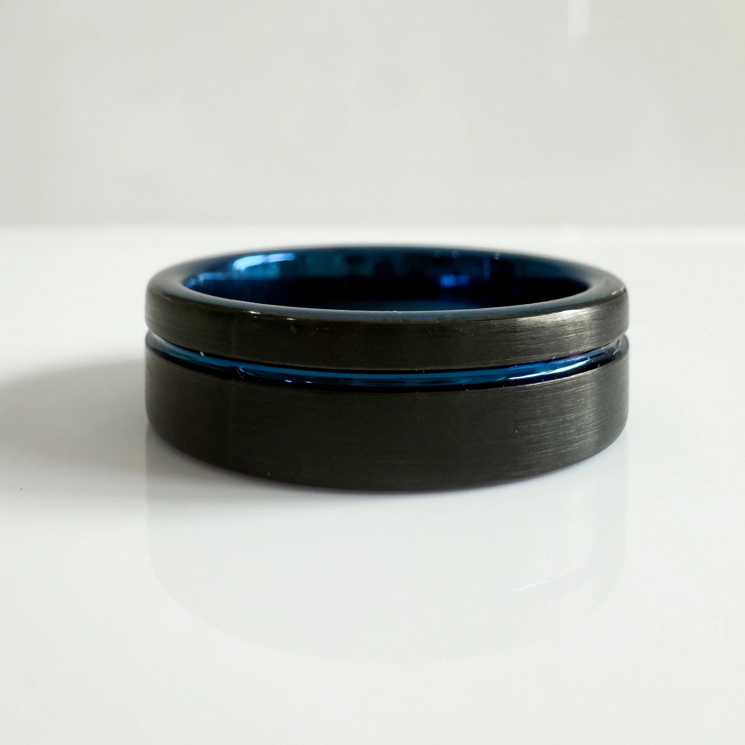 Men's engraved wedding band with blue detailing