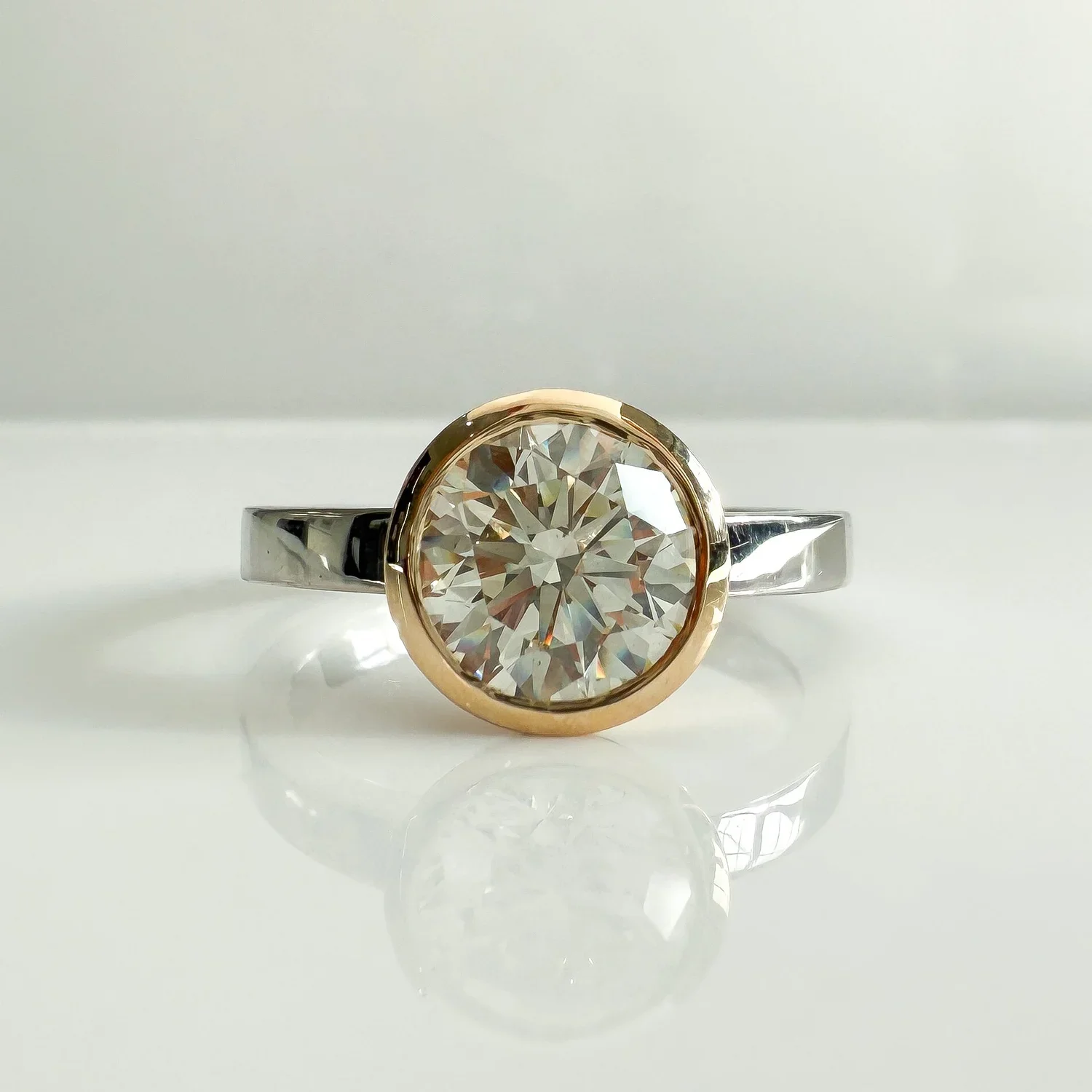 Solitaire yellow and white gold diamond ring