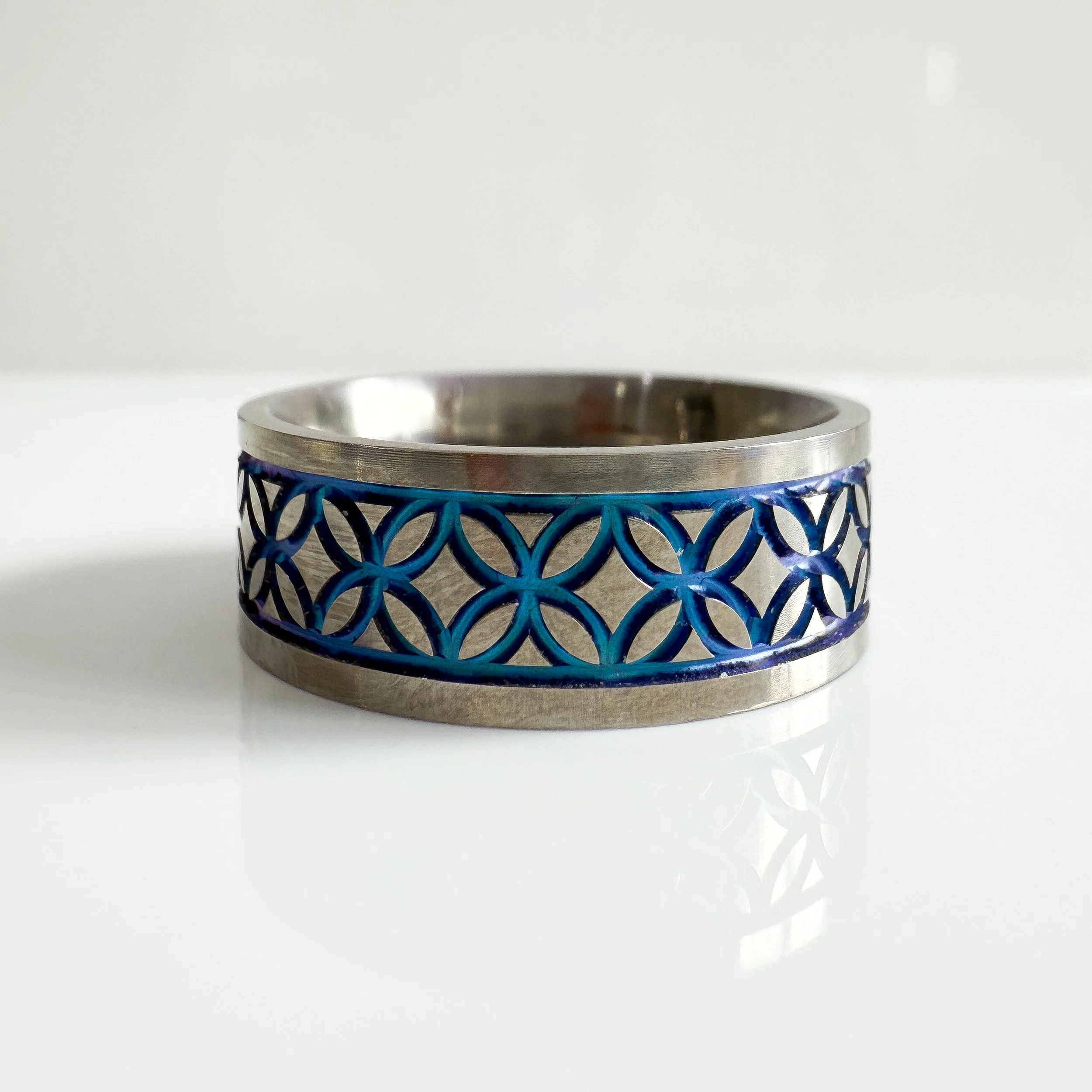 Men's engraved wedding band with blue detailing