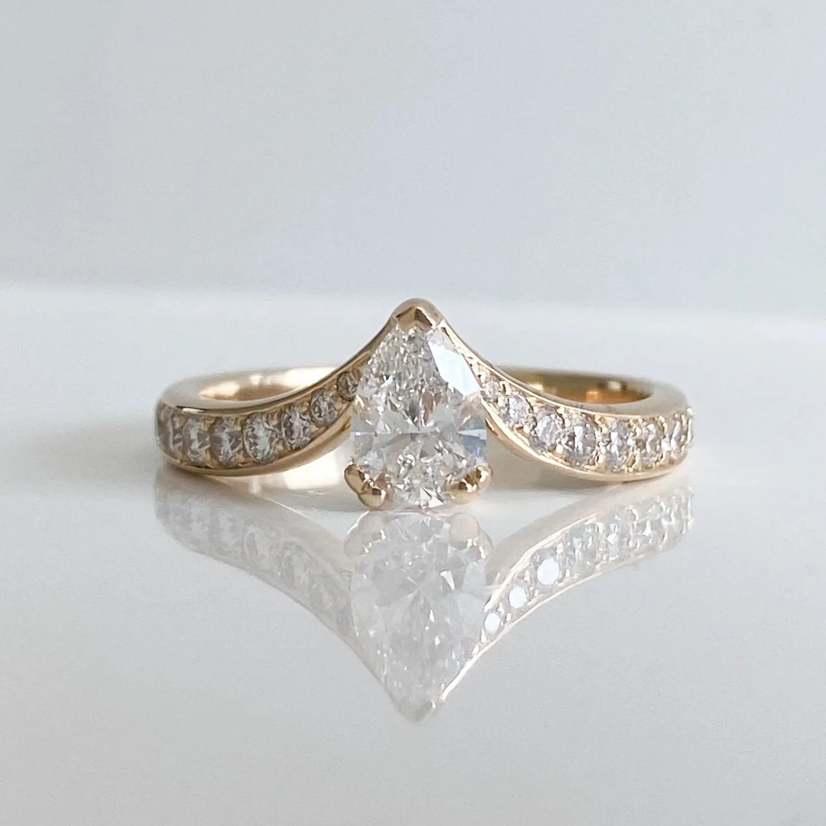 Teardrop wave shaped engagement ring