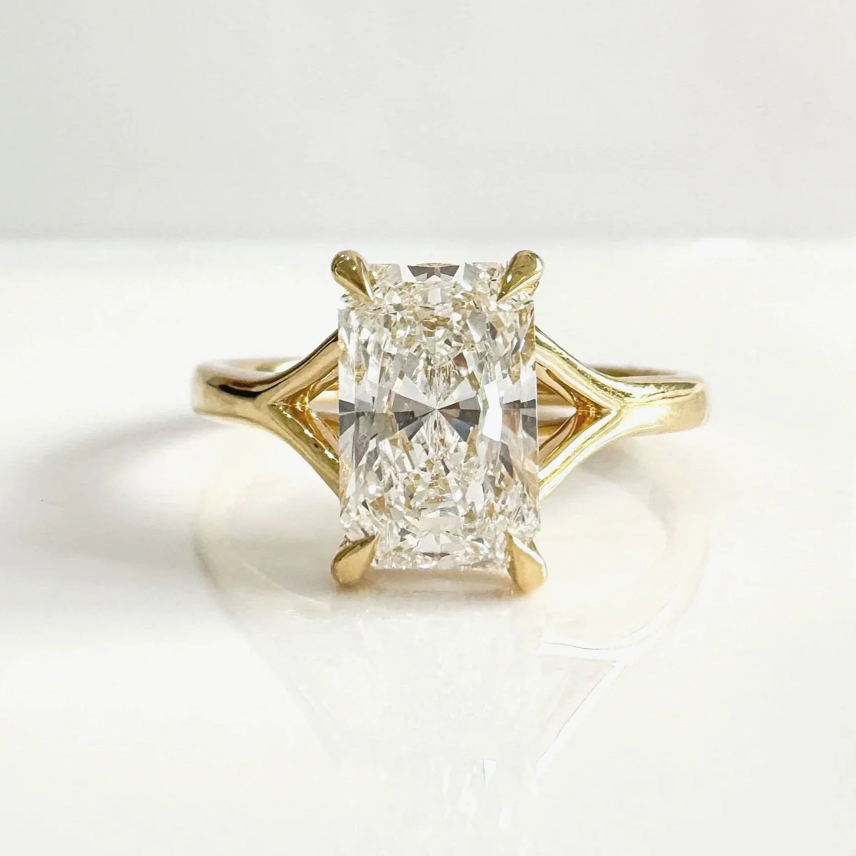 Split shoulder hidden halo diamond ring