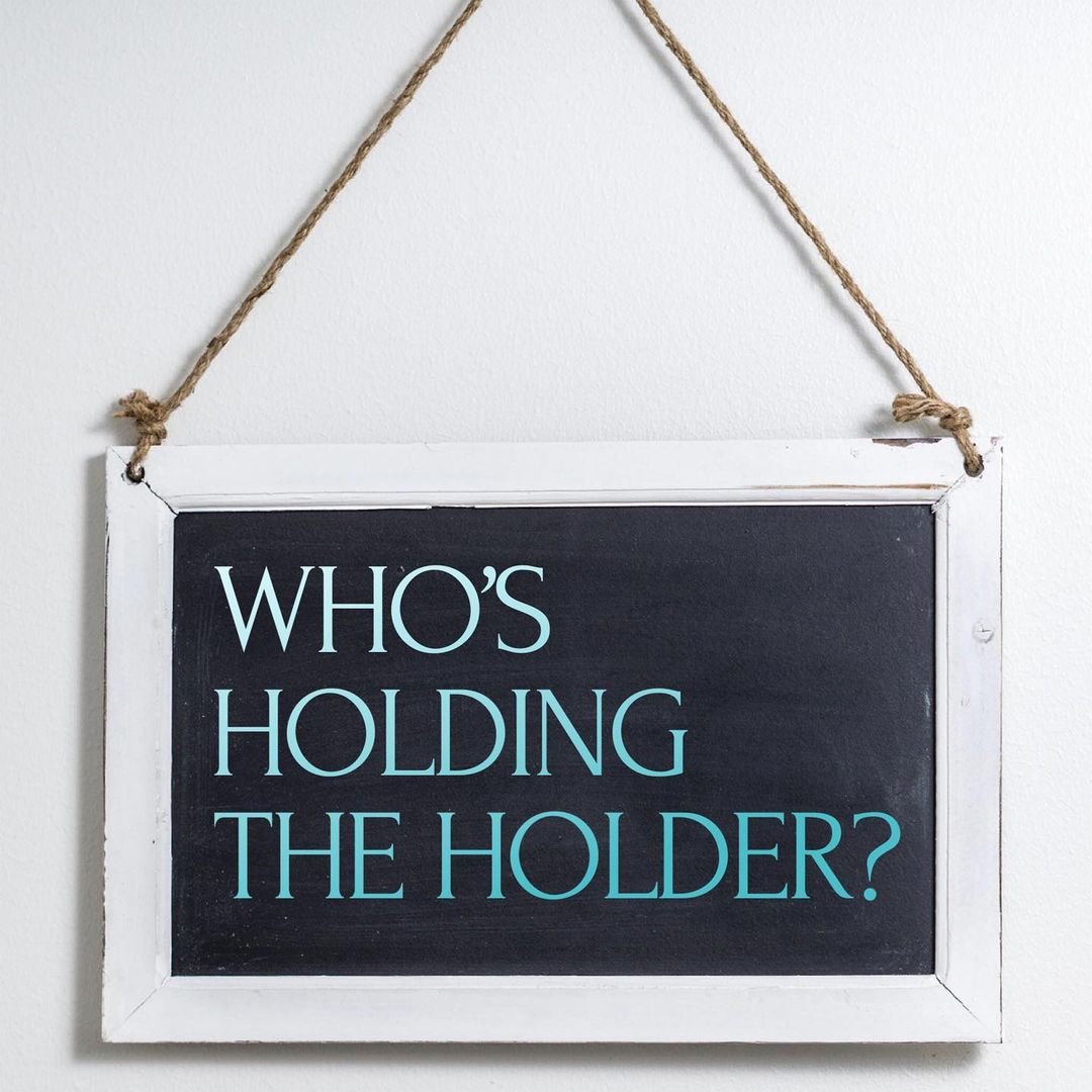 Who’s holding the holder?