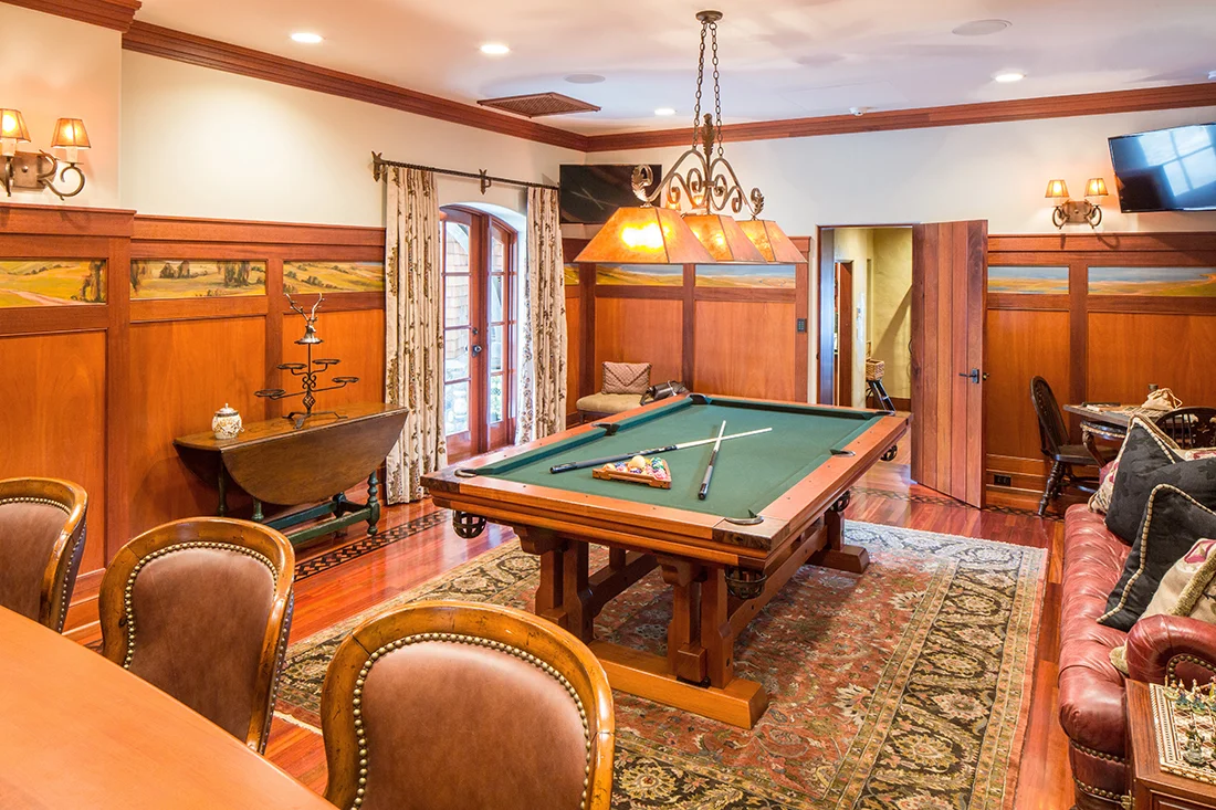 Two 50” LED TV’s with independent control enhance the Billiards and Bar Room. More impressive are the hand-painted panels that imagine the home’s surrounding terrain 200 years ago.