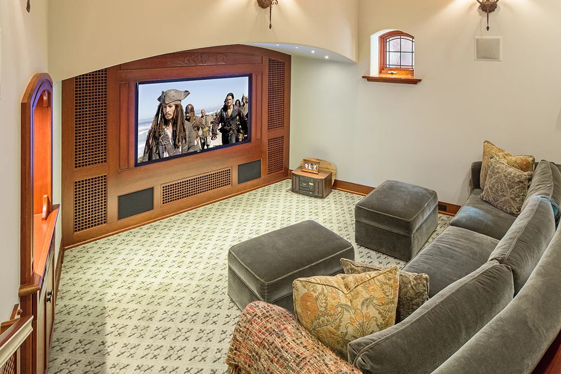 This intimate dedicated theater features a 70” Plasma TV, and 7.1 Surround from Arcam and Triad.