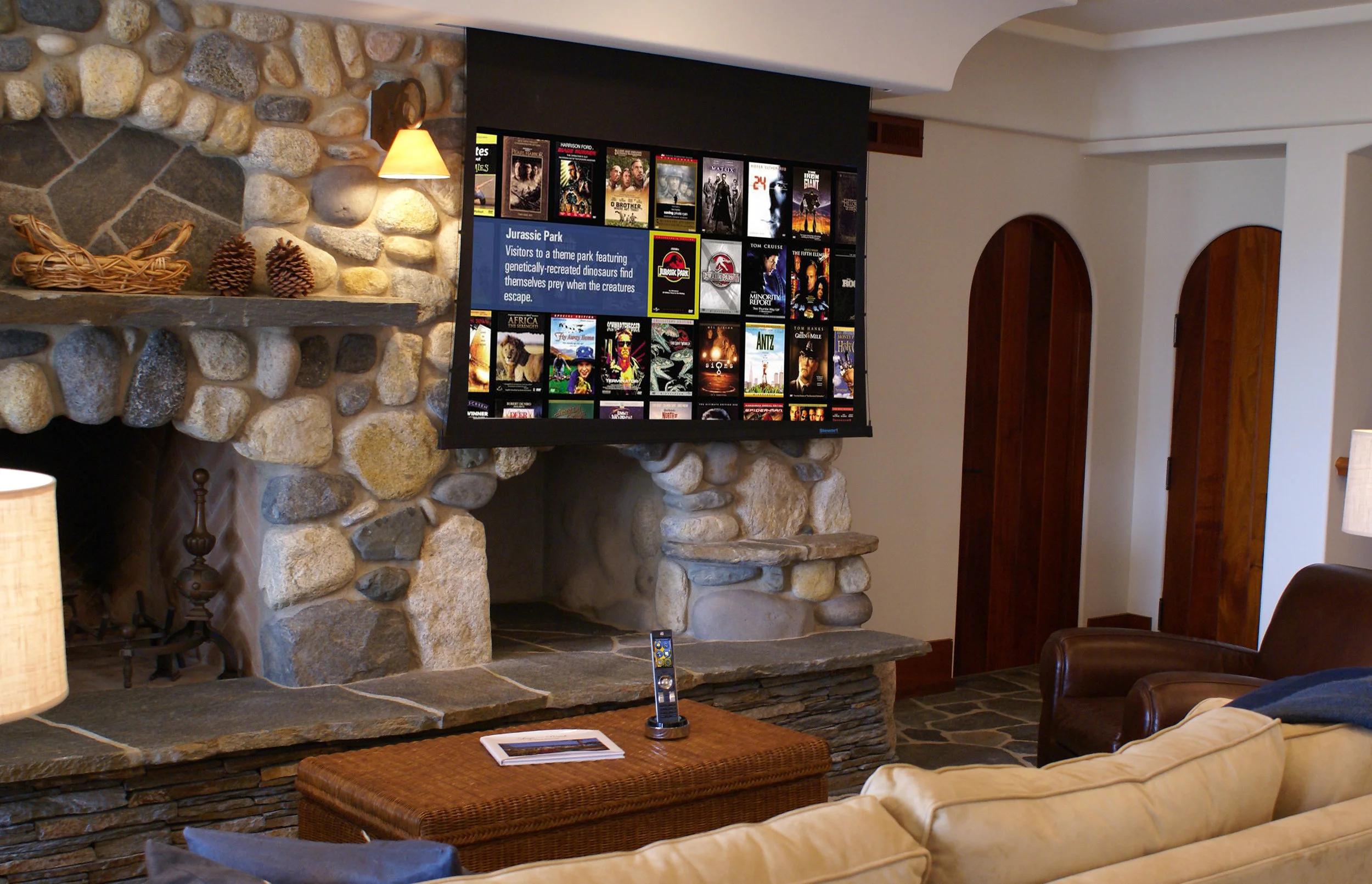 One of two media rooms on property, this motorized Stewart screen system disappears when not in use.