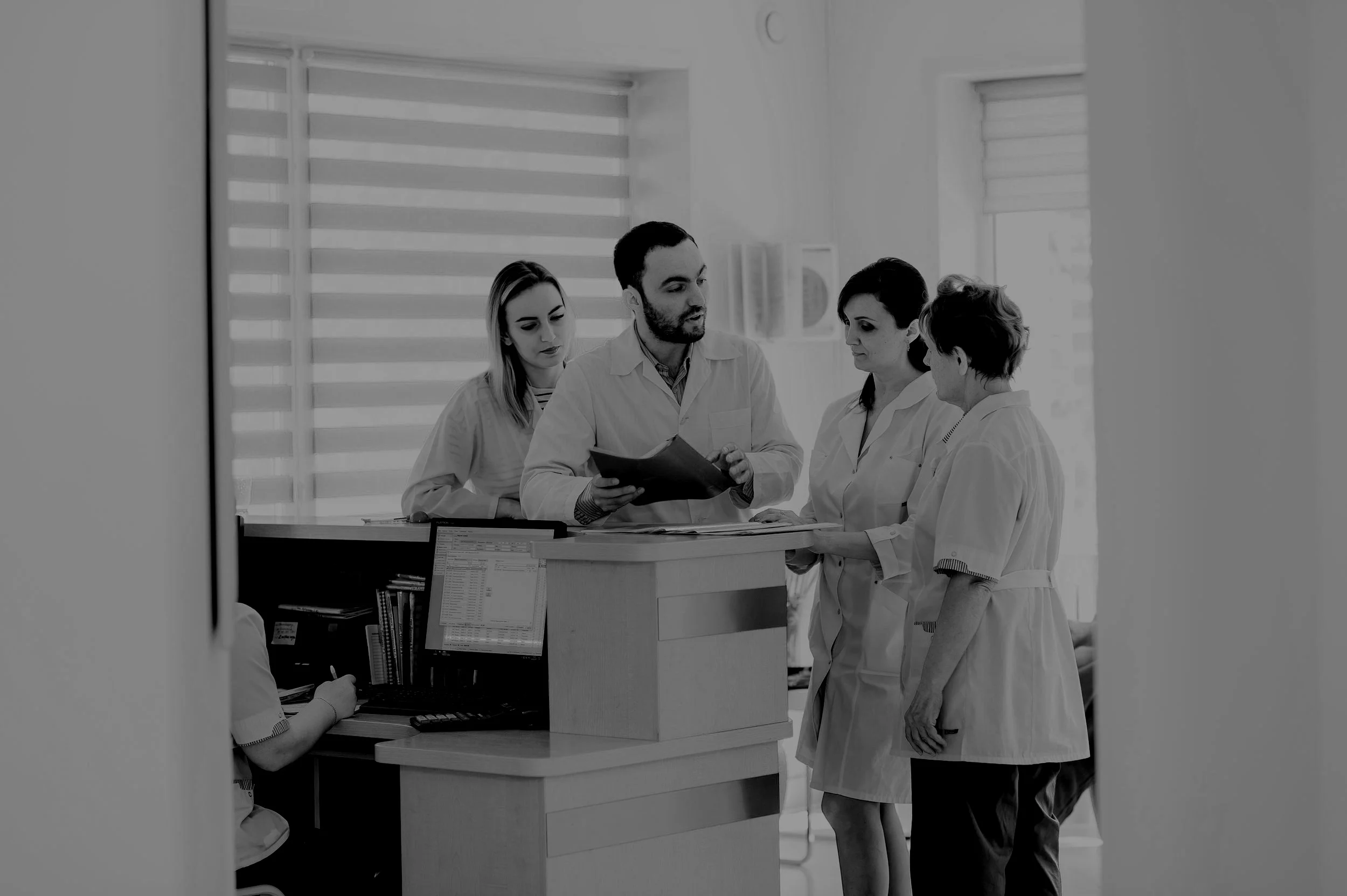 doctor-and-receptionist-at-reception-in-a-PB68Z5M.jpg