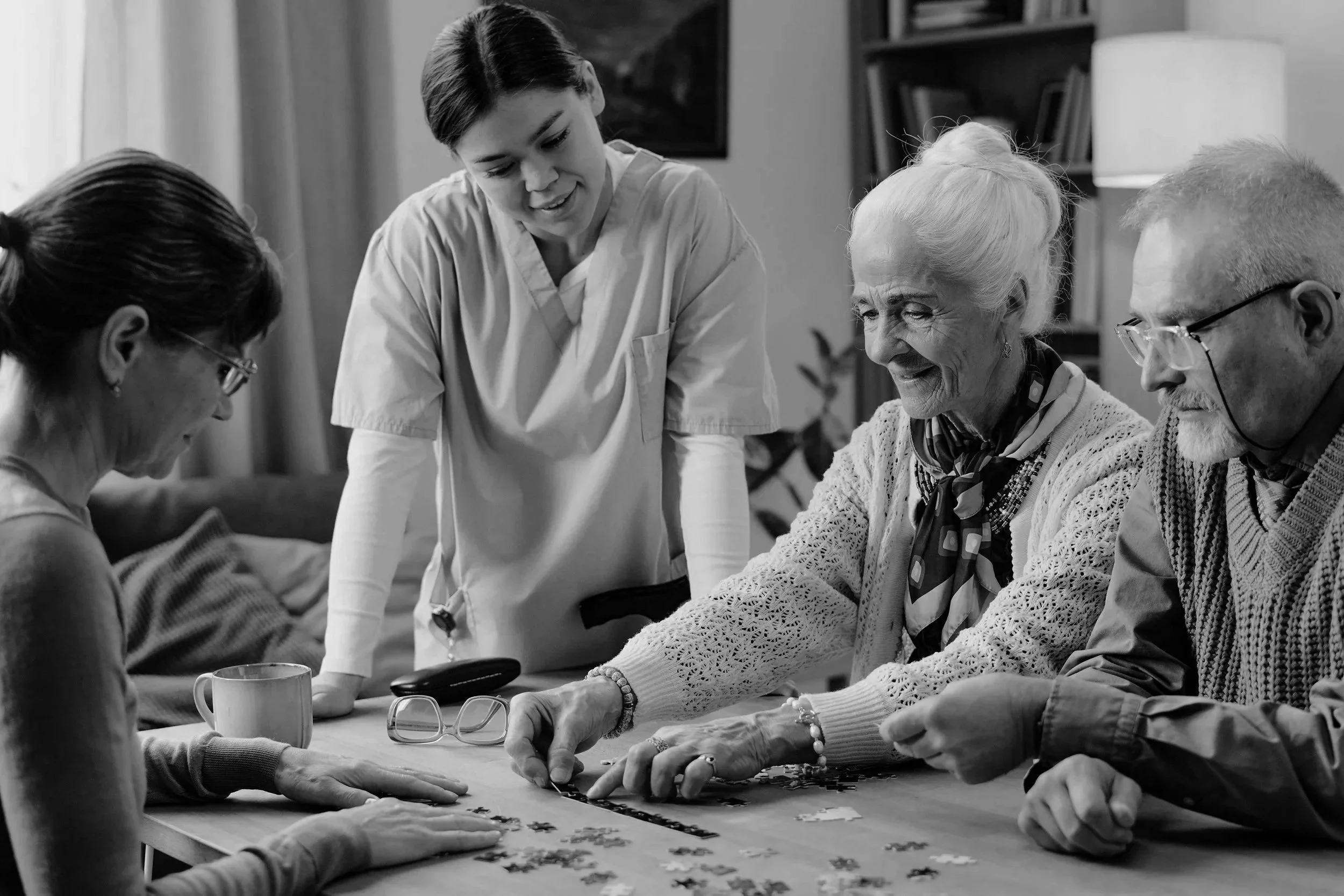 senior-woman-and-man-solving-puzzle-with-nurse-ass-2025-12-05-22-41-44-utc.jpg