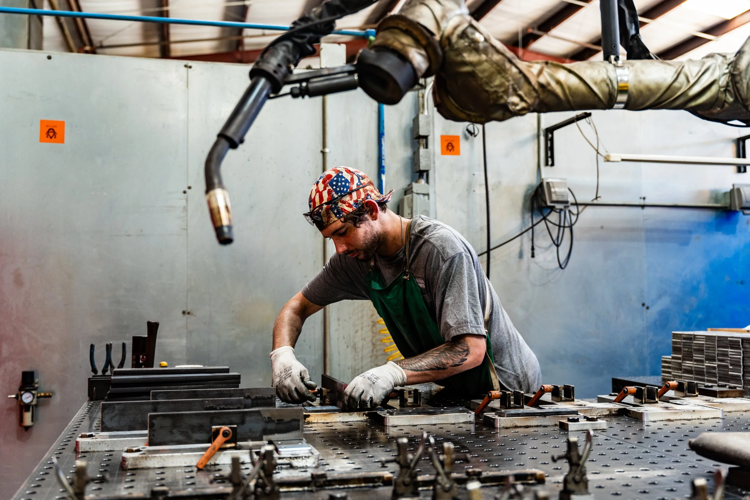 Welder prepares fixtures for Vectis cobot welder