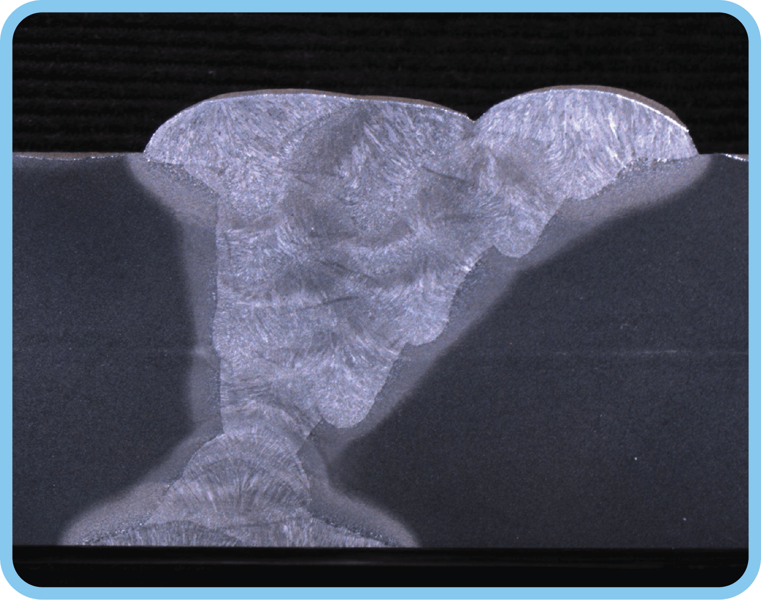 Cross-section of a welded moment joint showing the weld profile.