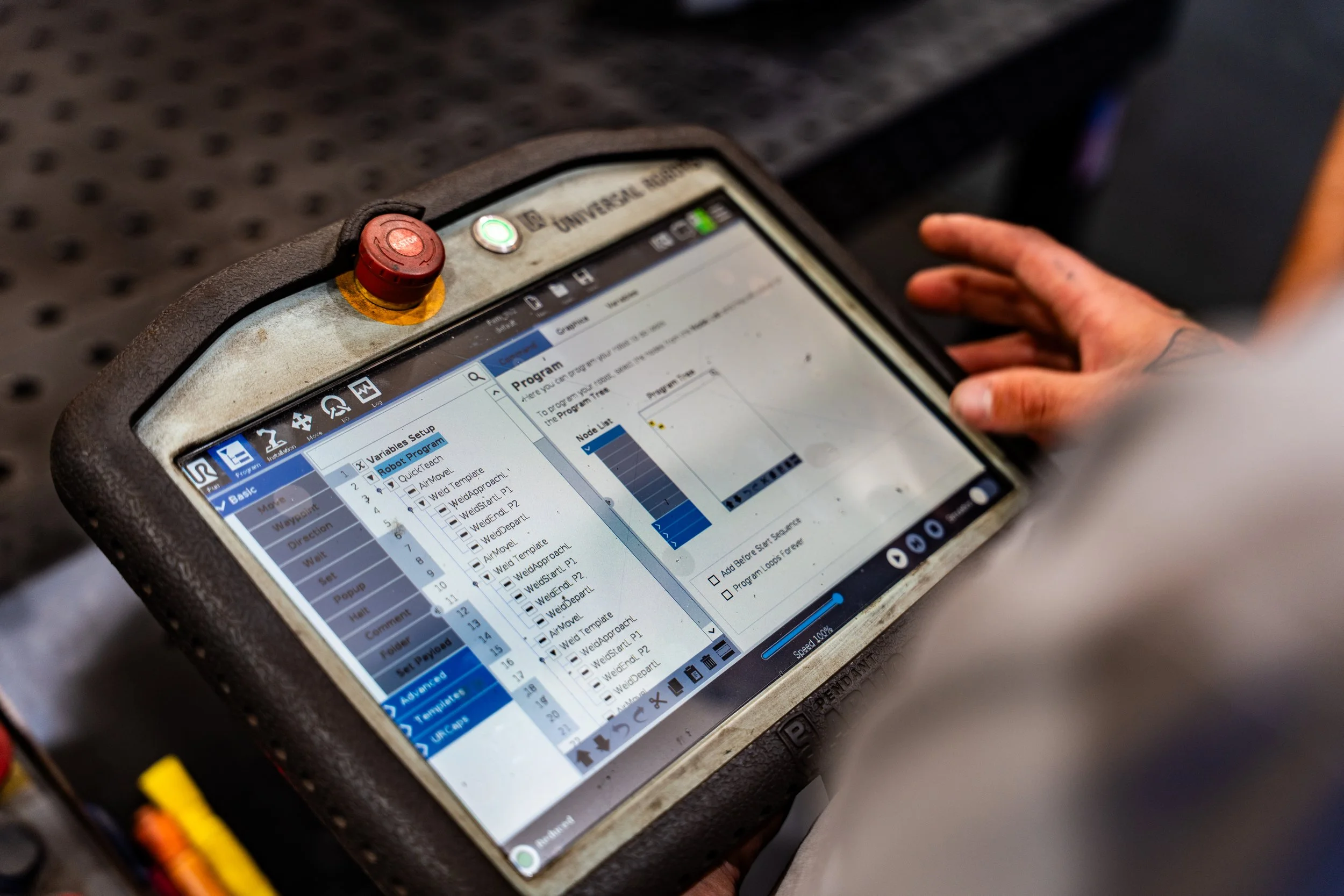 Closeup of Universal Robots pendant with Vectis Automation software