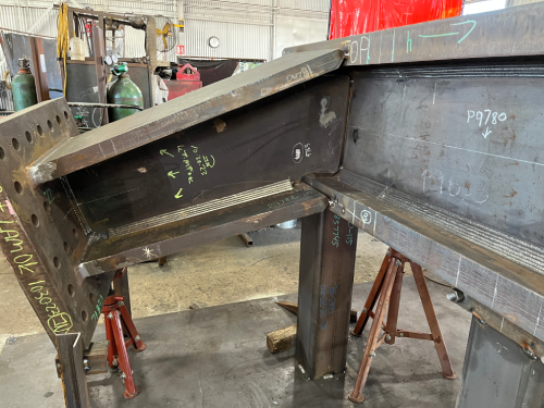 Structural steel moment connection fabricated with Vectis cobot welding automation.