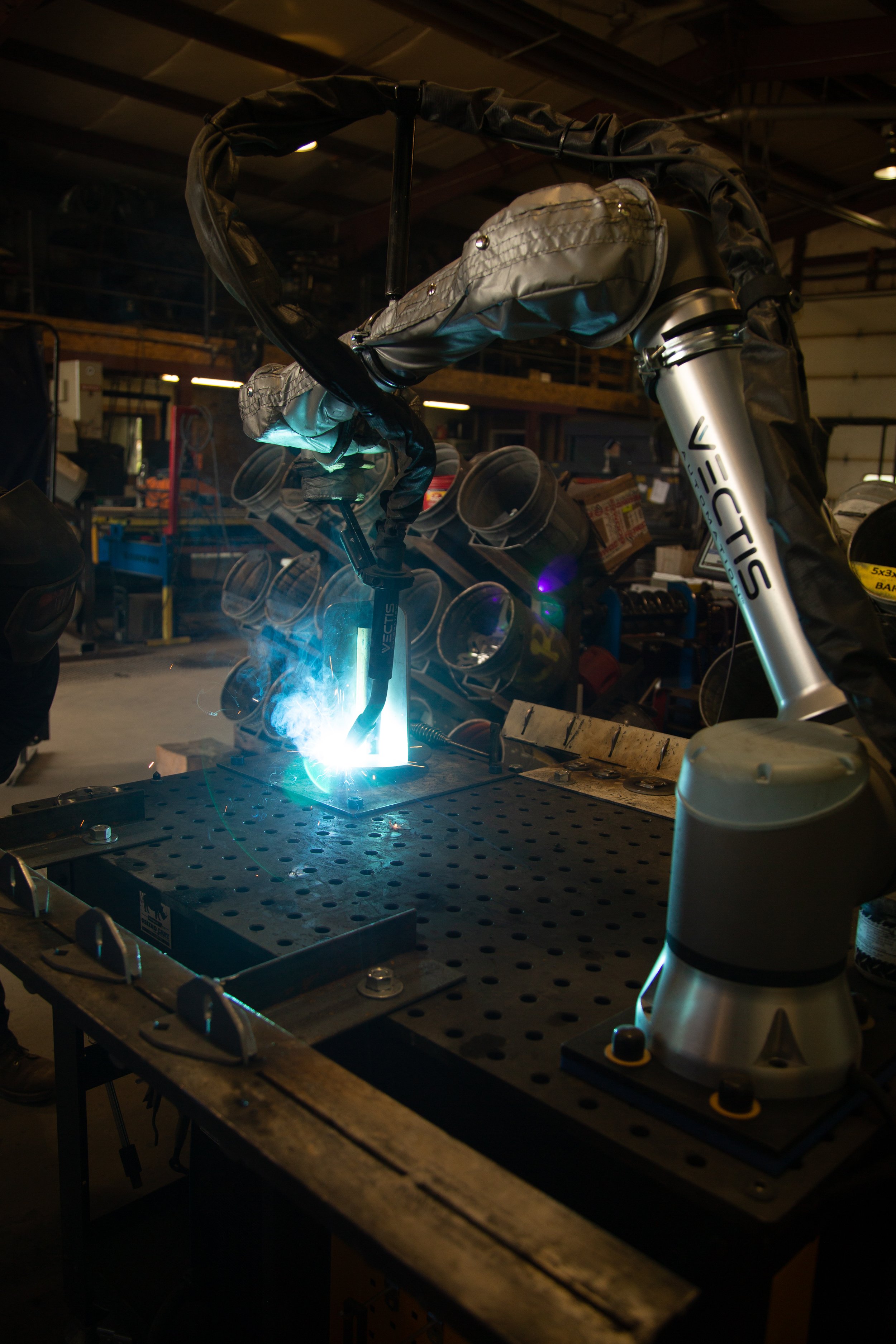 Vectis cobot welder welds part at MT Solar fabrication shop