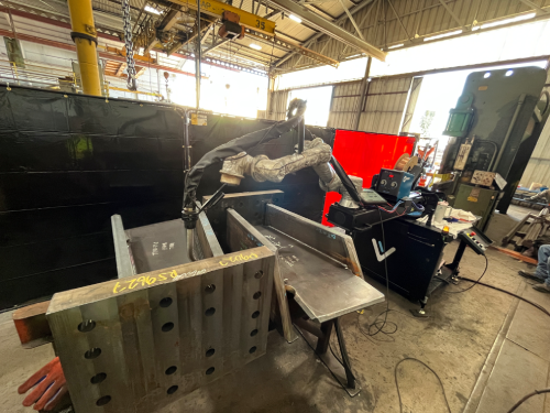 Cobot welding a large structural steel moment connection using Vectis Cobot.