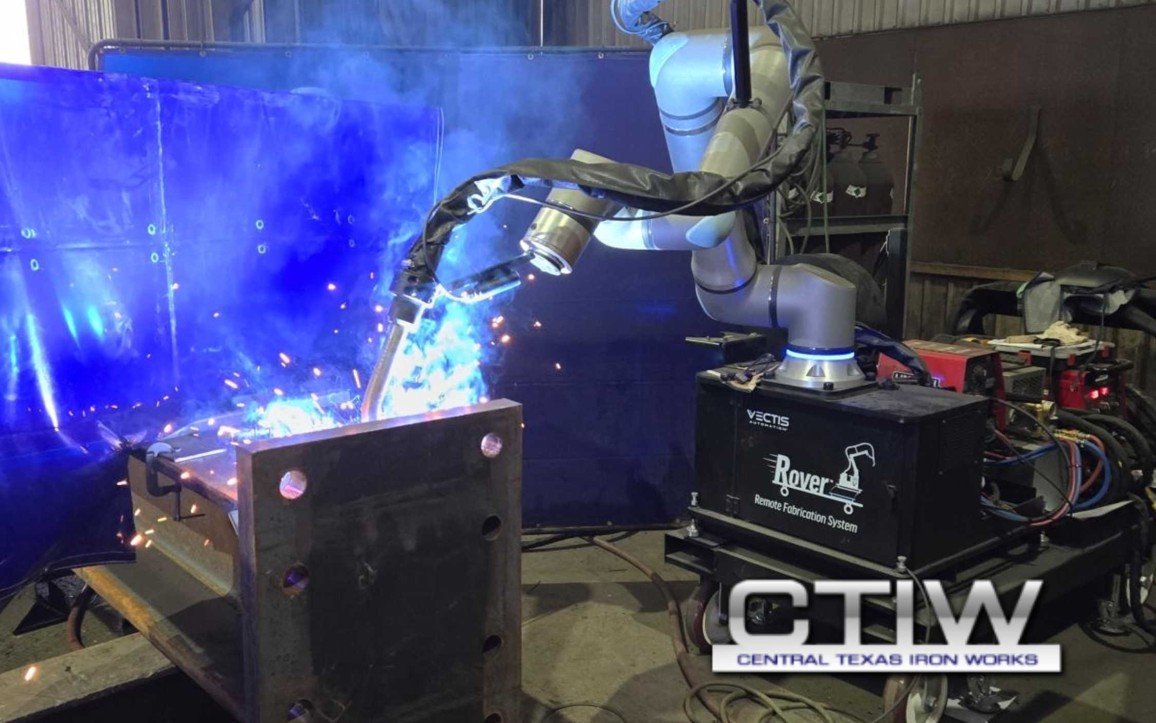 Vectis cobot welding system performing a weld on a large steel fabrication at Central Texas Iron Works.