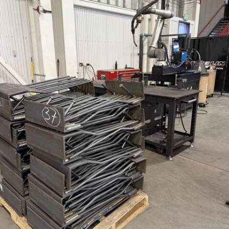 Finished structural steel embed assemblies at Fineline Steel with Vectis automation in the fabrication shop.