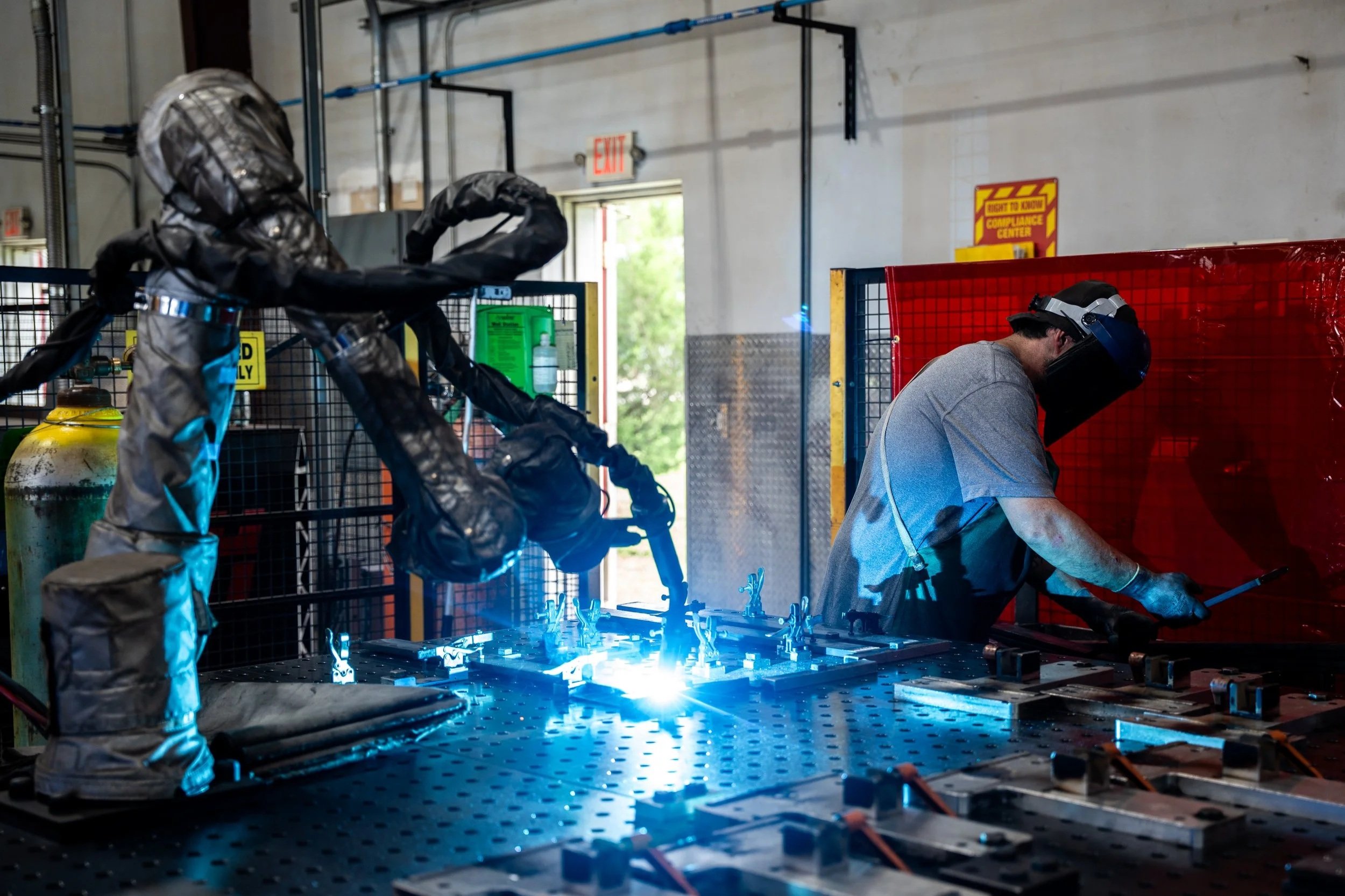 Vectis Automation cobot welder and worker in fabrication shop