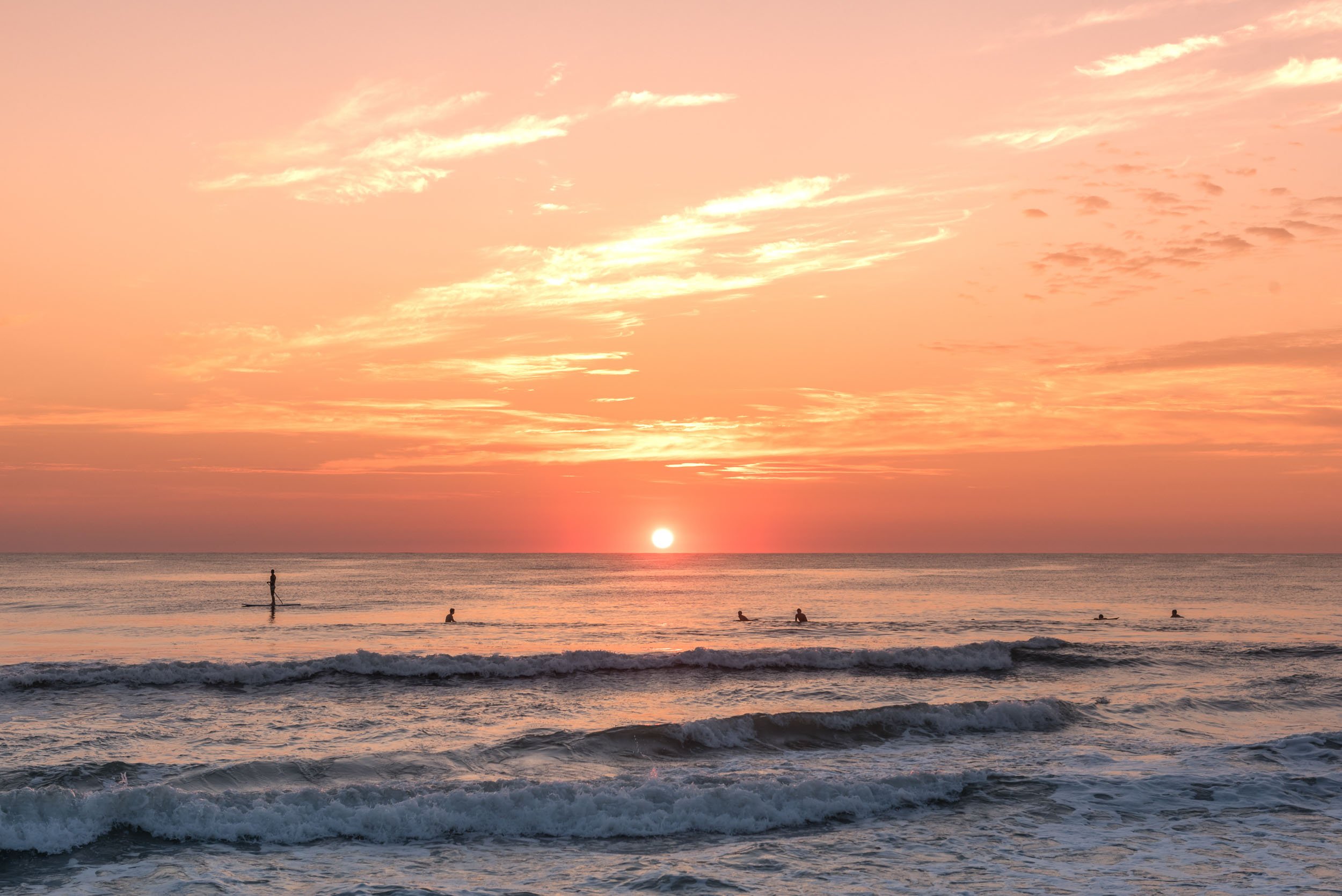 Surfing at Sunrise Sandbridge Virginia Beach.jpg