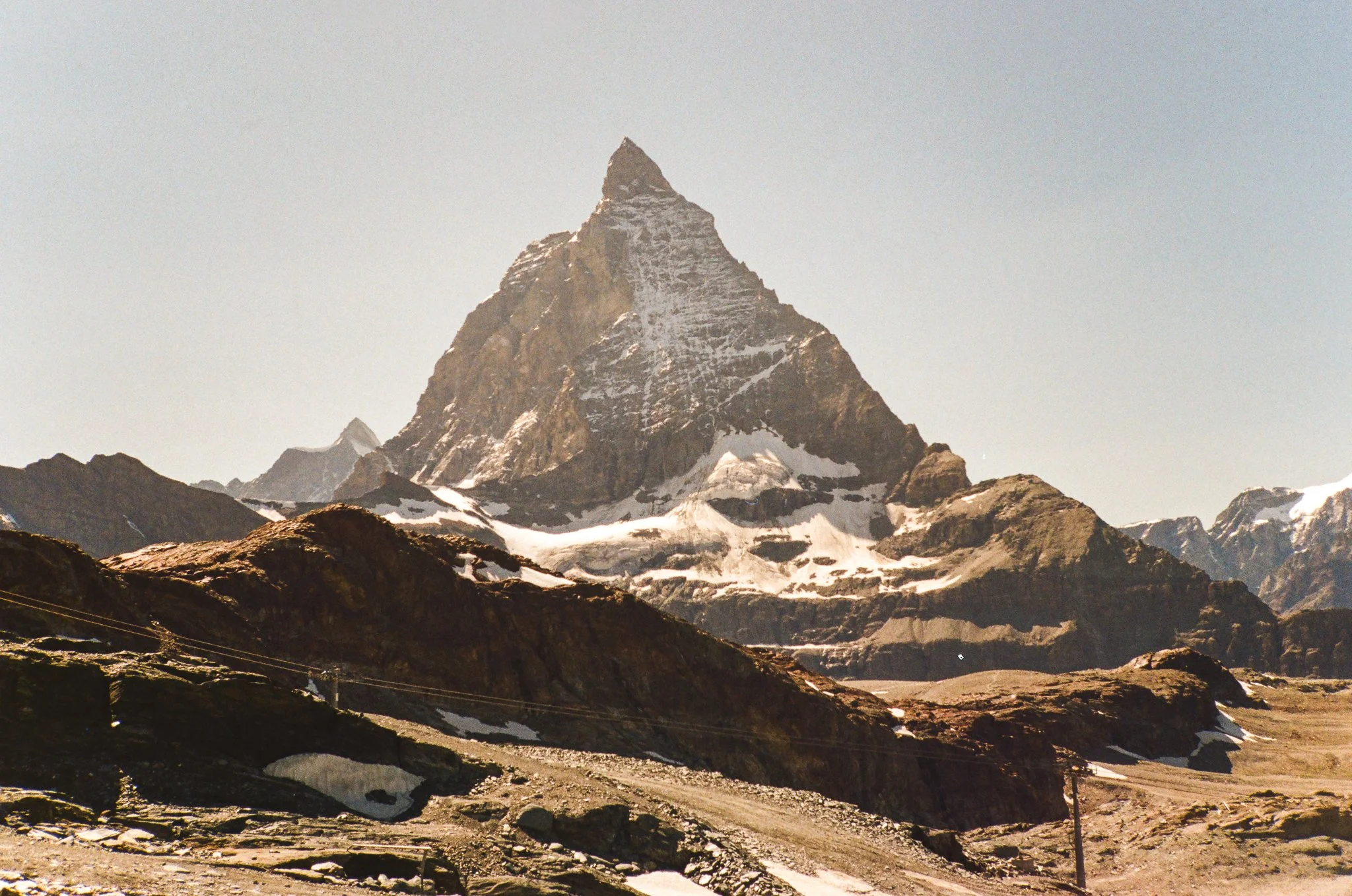 🎞️ The many views of the Matterhorn.  Each time I see it, it takes my breath away.  If you look closely on the flat-ish area to the right of the steep ridge, you'll see the very special @hoernlihuette.

📷 Contax T2
🎞️ Kodak Gold 200
🗓️ July 2025
