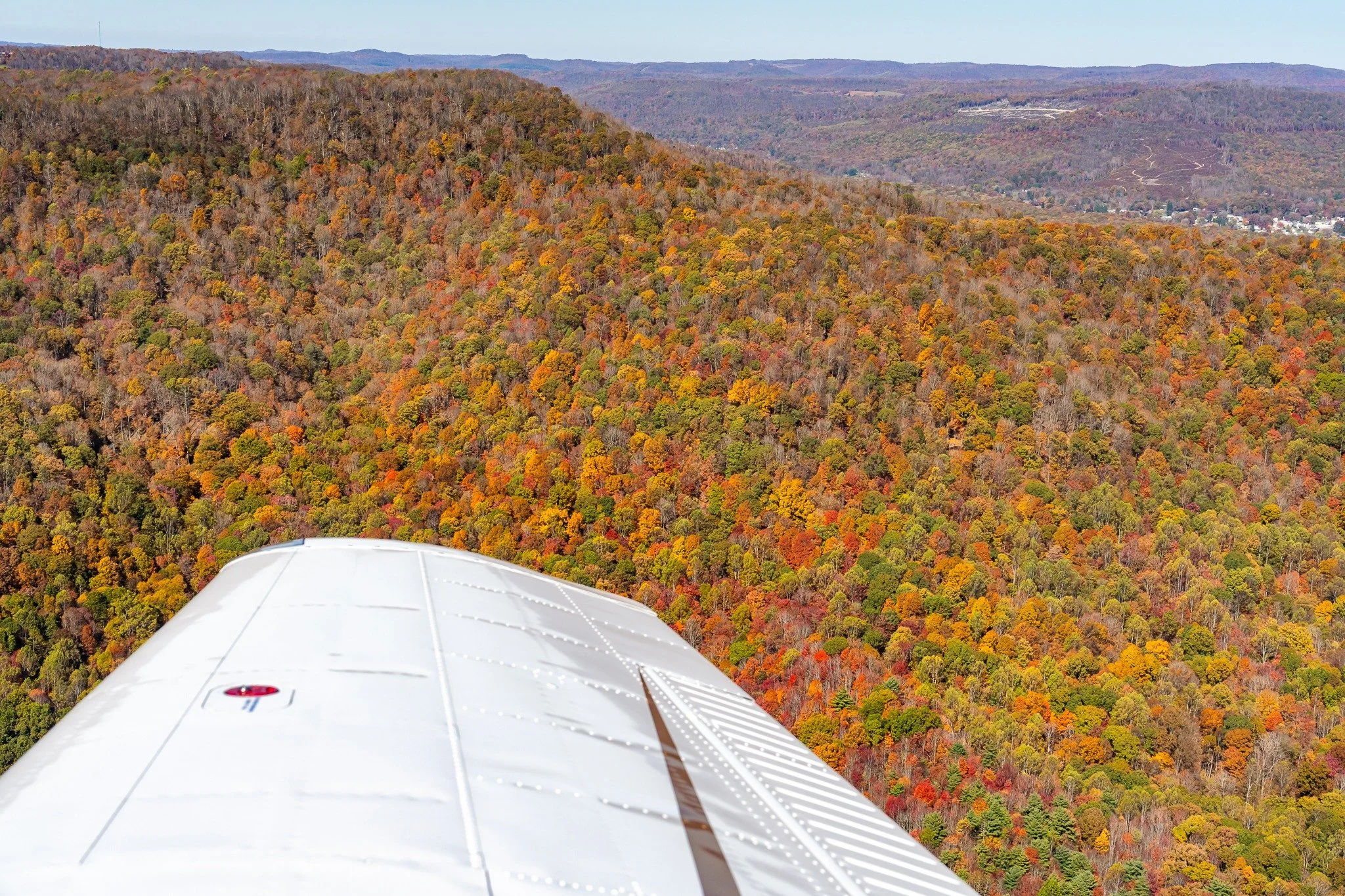 When you take thousands of photos each year, it's hard to stay of top of sharing them all.  The incredible thing about photography is that while time passes quickly, photos freeze the memories.  A year ago this week, we jumped in a friends small plan