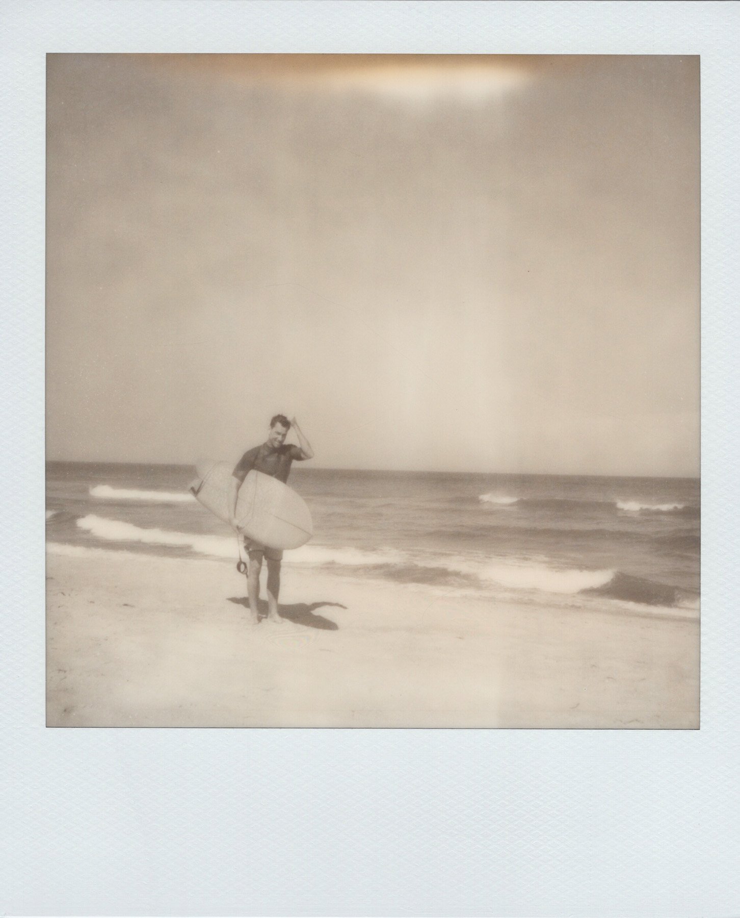 polaroid-sx-70-black-white-surfer-beach-obx.jpg