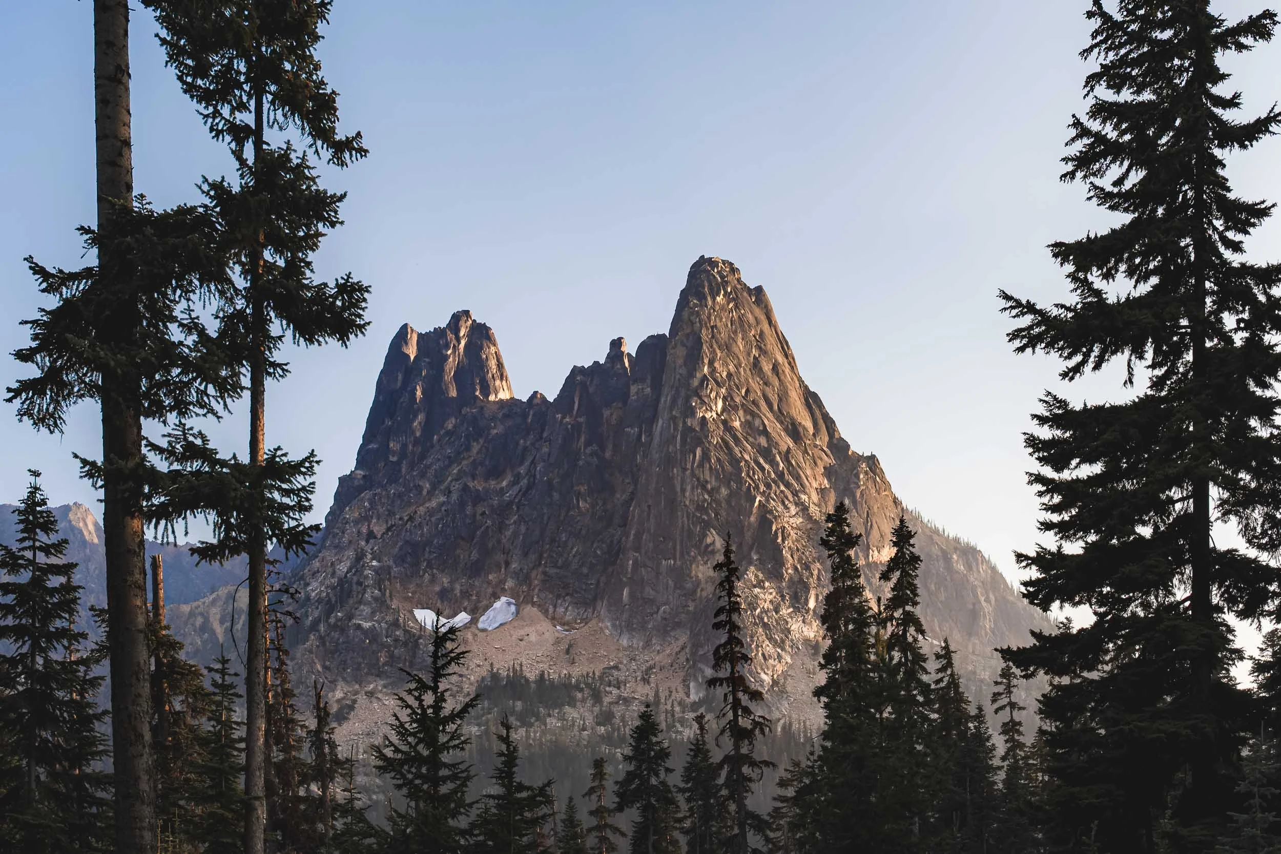 Liberty Bell framed through trees from Washington Pass Overlook