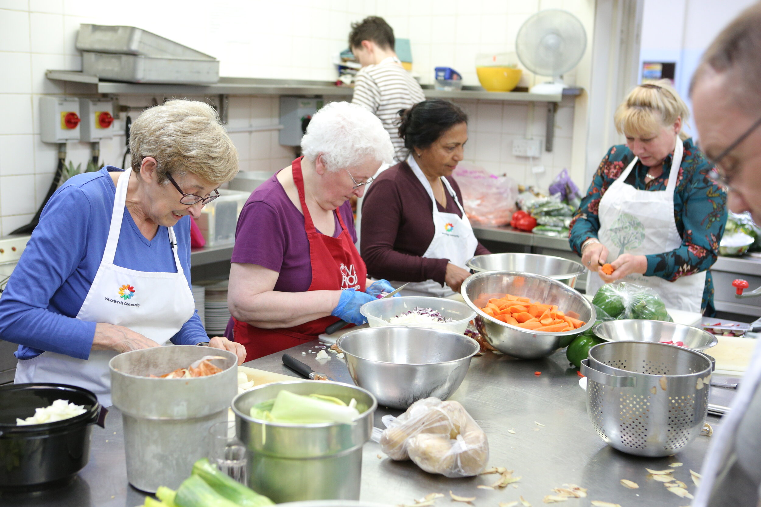 Esther working in kitchen.JPG