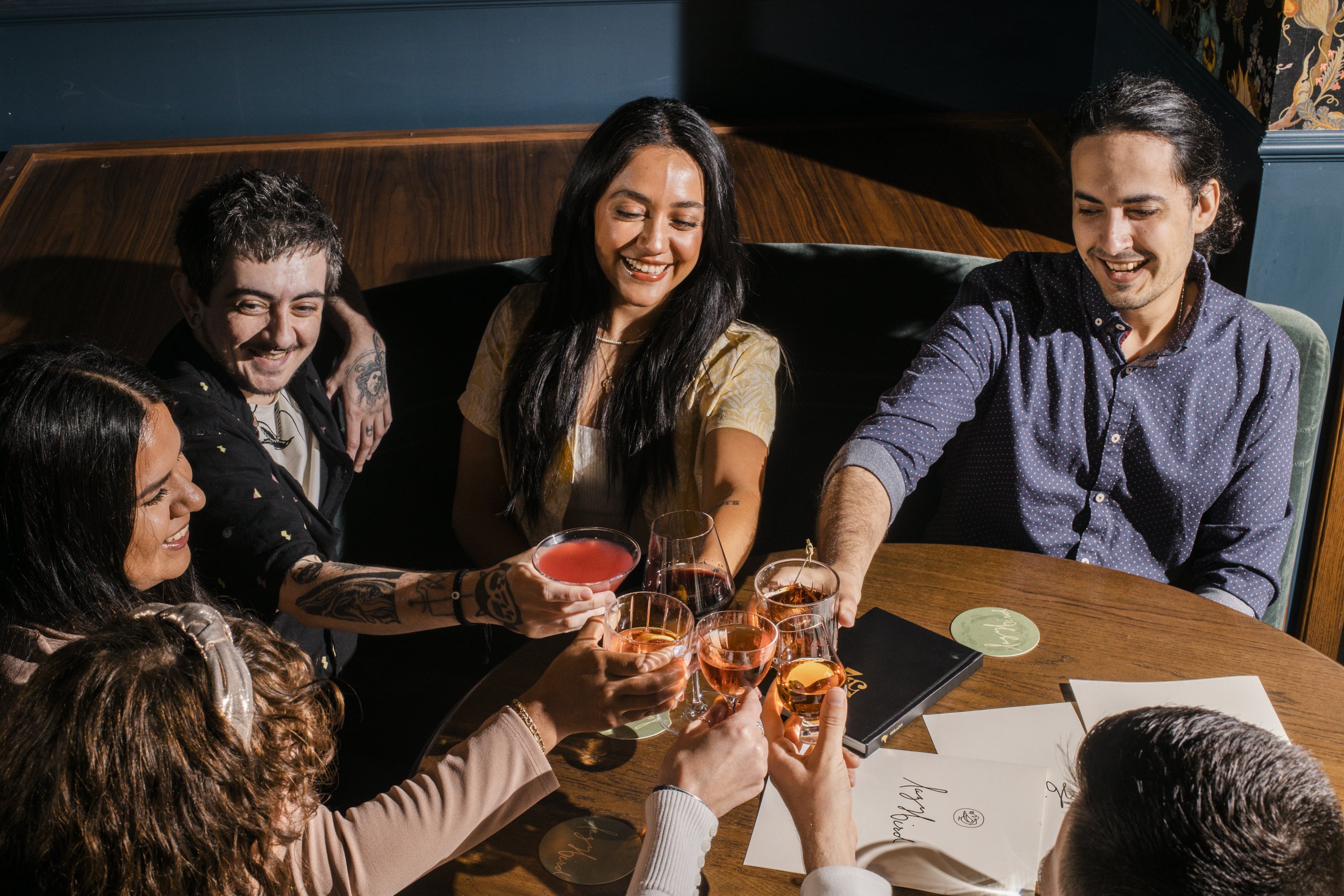  alt=”Group of people drinking Lazy Bird Cocktails” 