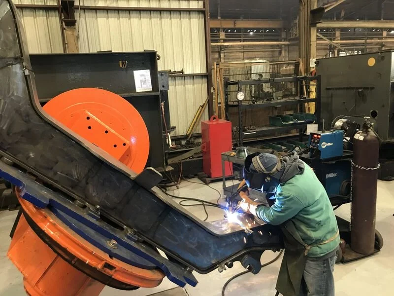 A worker welds a wheel assembly for a new Amtrak high-speed train at LB Steel in Harvey. (Ted Slowik/Daily Southtown)