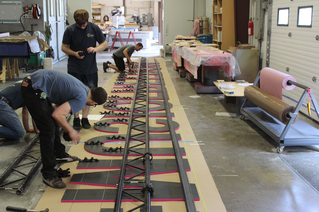 T-Mobile neon lettering sign being worked on at Czinkota Studios