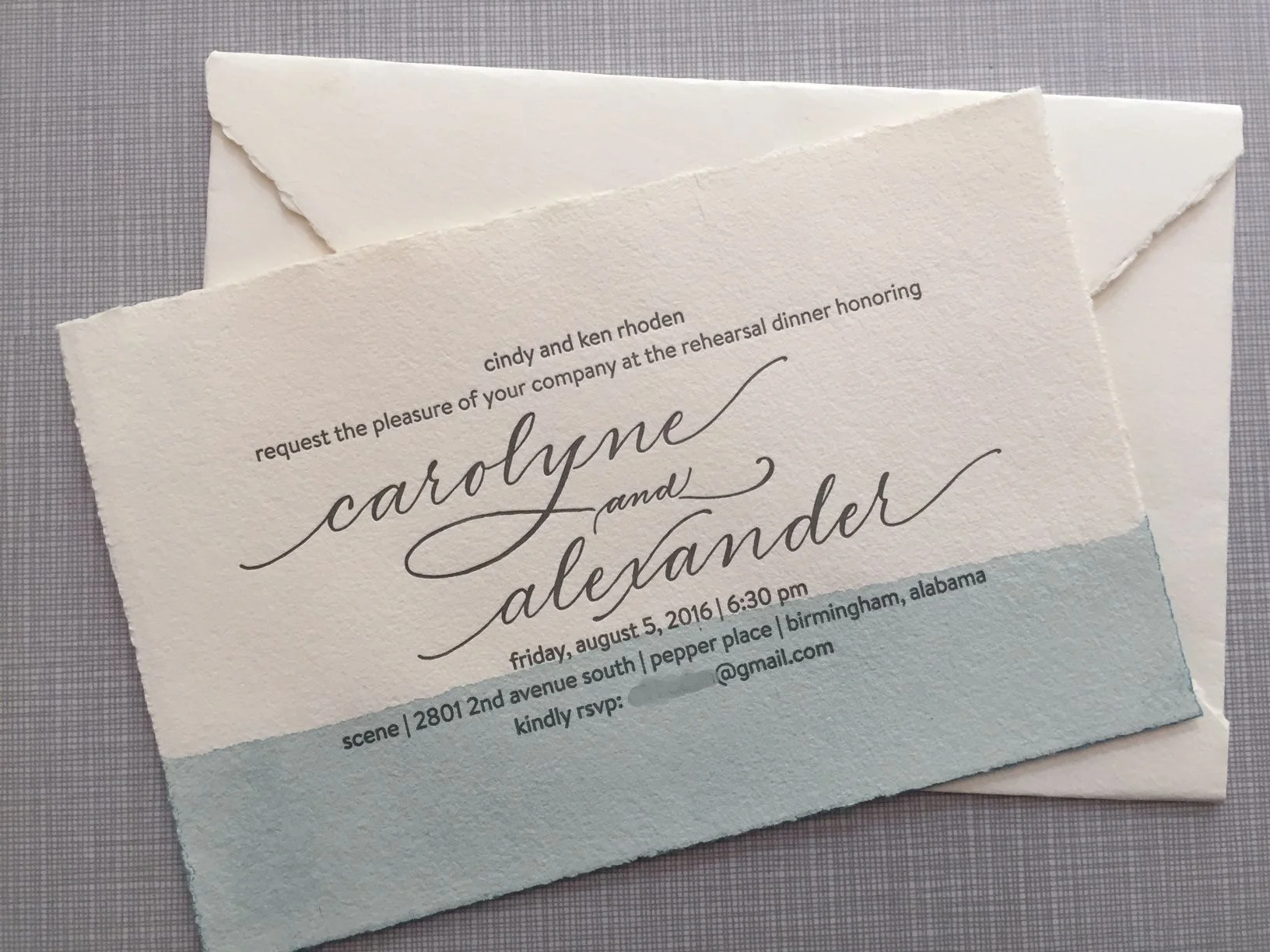 Hand-dipped watercolor invitations on spanish deckled edge paper, featuring hand calligraphy for names.
