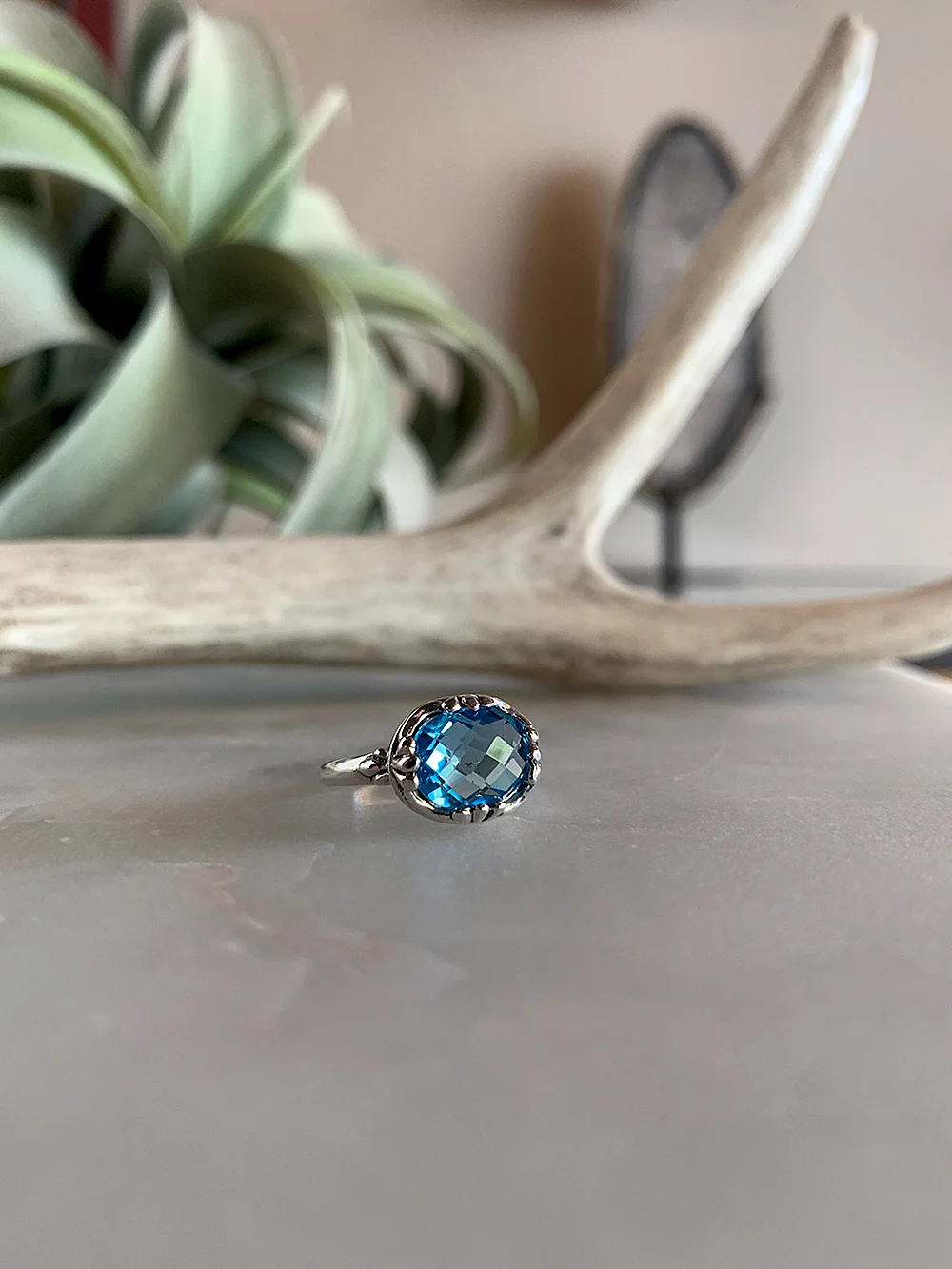 sterlingsilvercushionbluetopaz-faceon$99_web.jpg