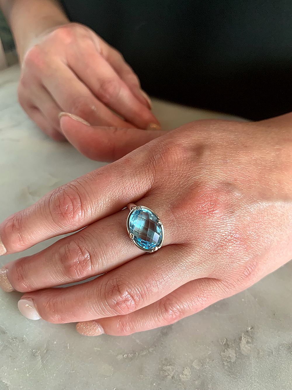sterlingsilverovalbluetopazring-hand$98_web.jpg