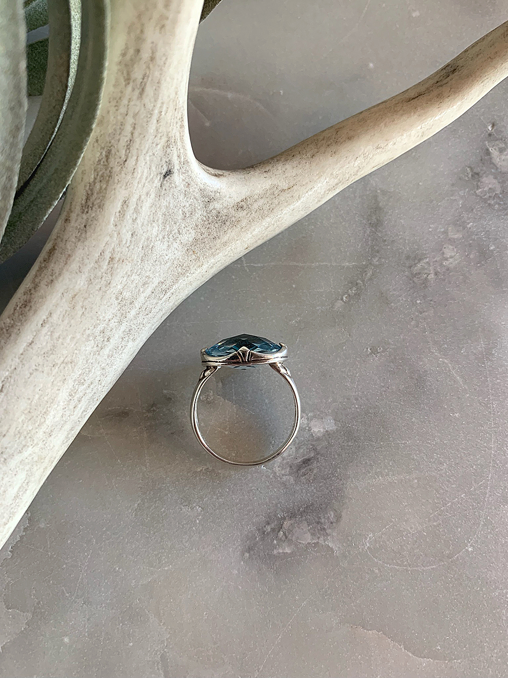 sterlingsilverovalbluetopazring-sideview$98_web.jpg
