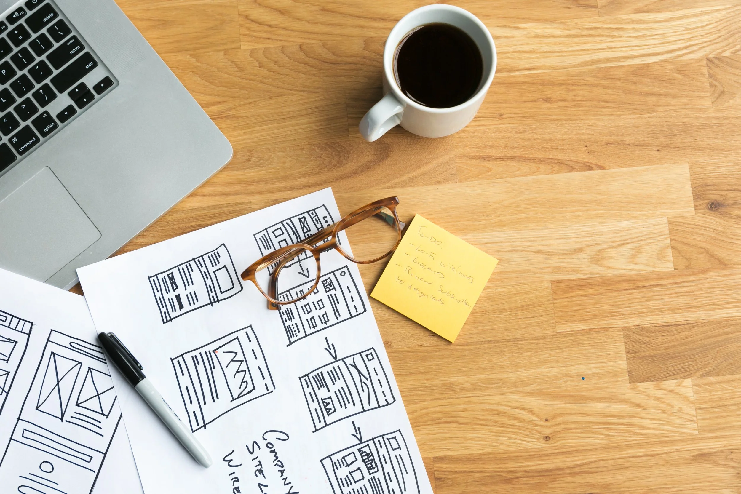 designers-desk-with-coffee-wireframes (1).jpg