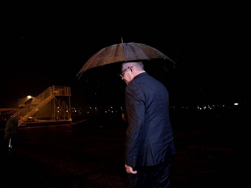 Scott Morrison in the rain.jpg