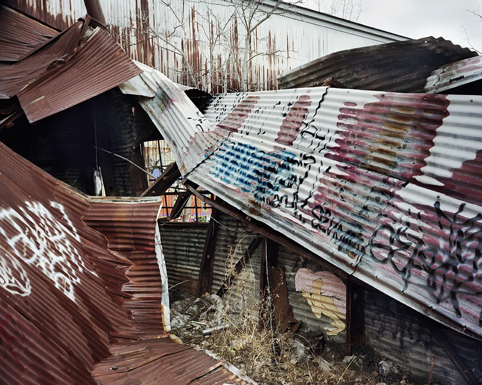 Cover, pigment print archival photograph of installed of wheatpaste screenprint, 40 x 50”, 2012