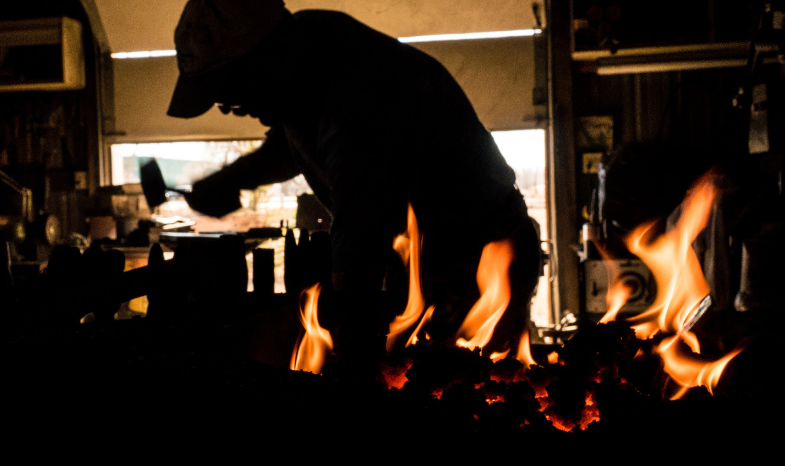  Carl Plehaty forges a fire poker at his blacksmith shop in Erie, Colo., on the morning of Feb. 16, 2017. 