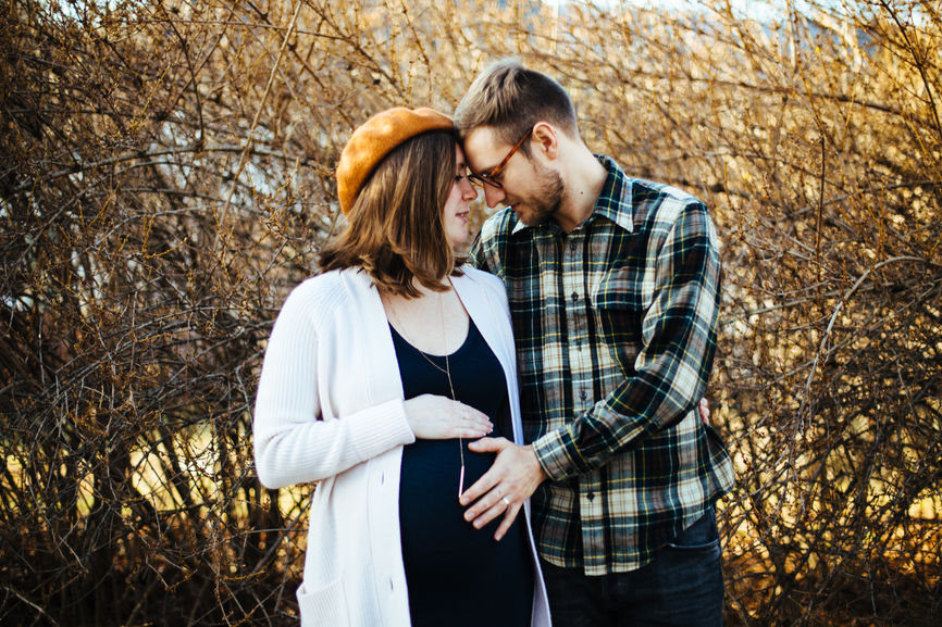 Happy pregnant couple who conceived using eastern and western fertility treatments