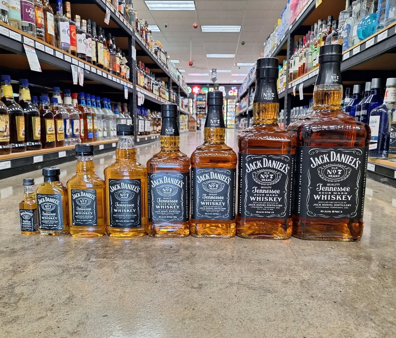 When we say we have a big selection, we mean it! Every size of @jackdaniels_us #whiskey from 50ml all the way up 3 liters! Something for everyone. #ontherocksliquor #lawrenceks #jackdaniels