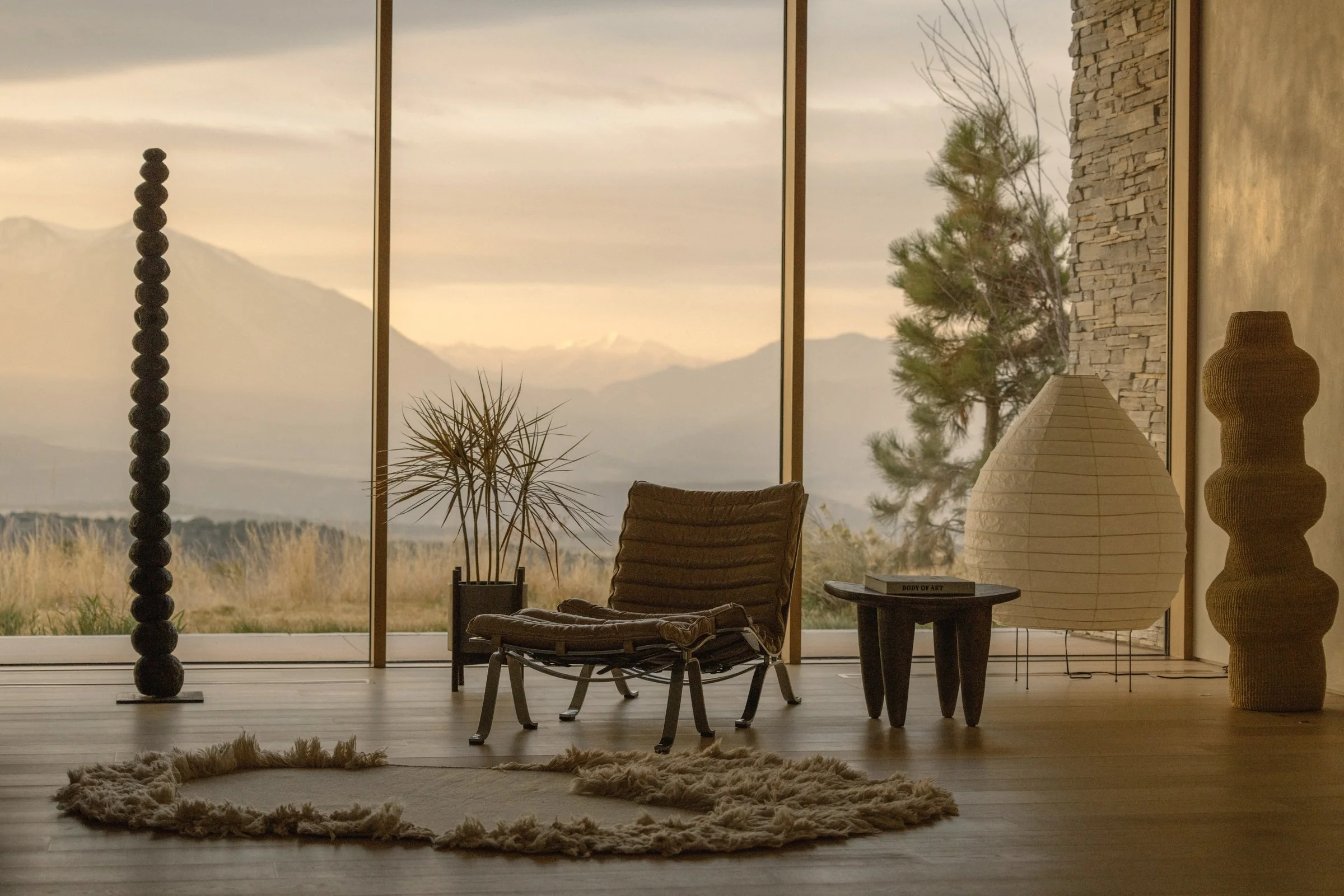 Living room with full-height windows to the valley