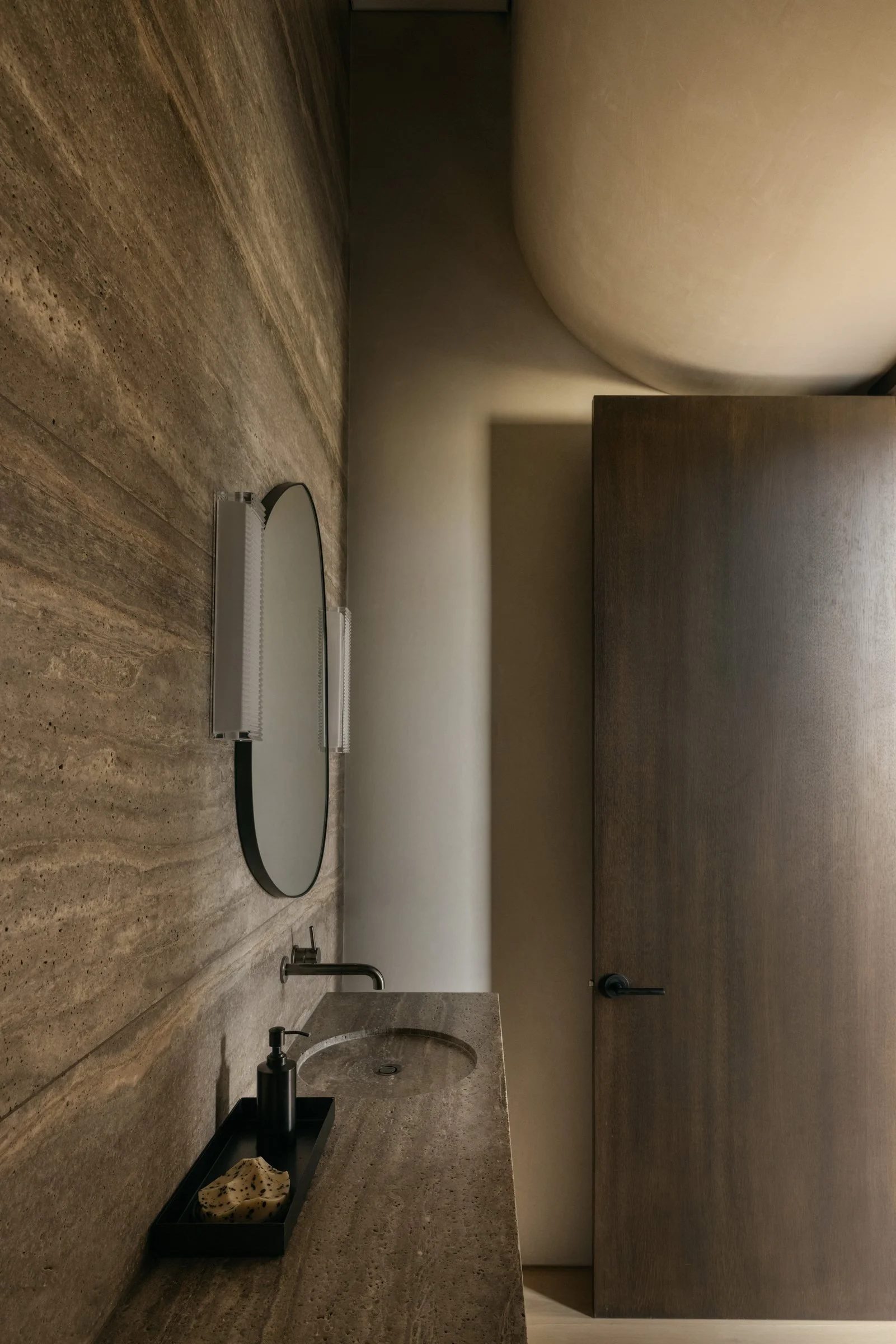 Travertine wall and vanity