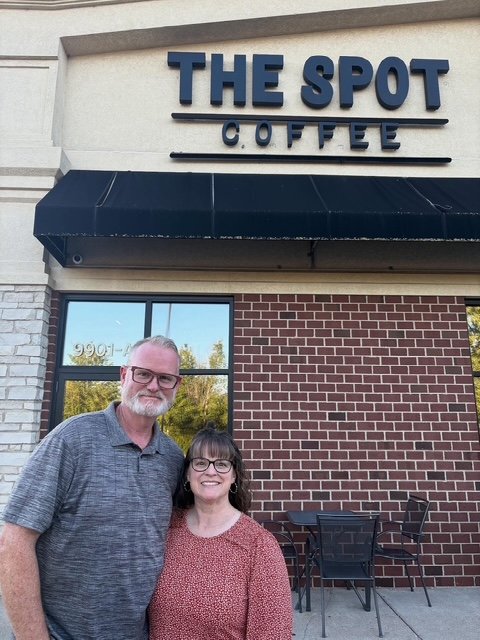 The owners(Jay and Jenny) posing outside The Spot Coffee